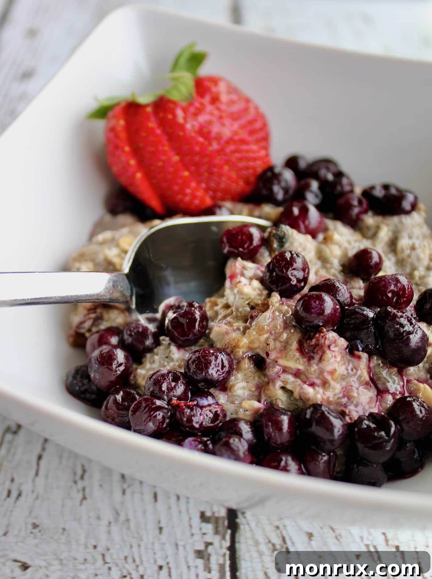 A vibrant bowl of Chia Breakfast Pudding topped with fresh blueberries, ready for a healthy start to the day.