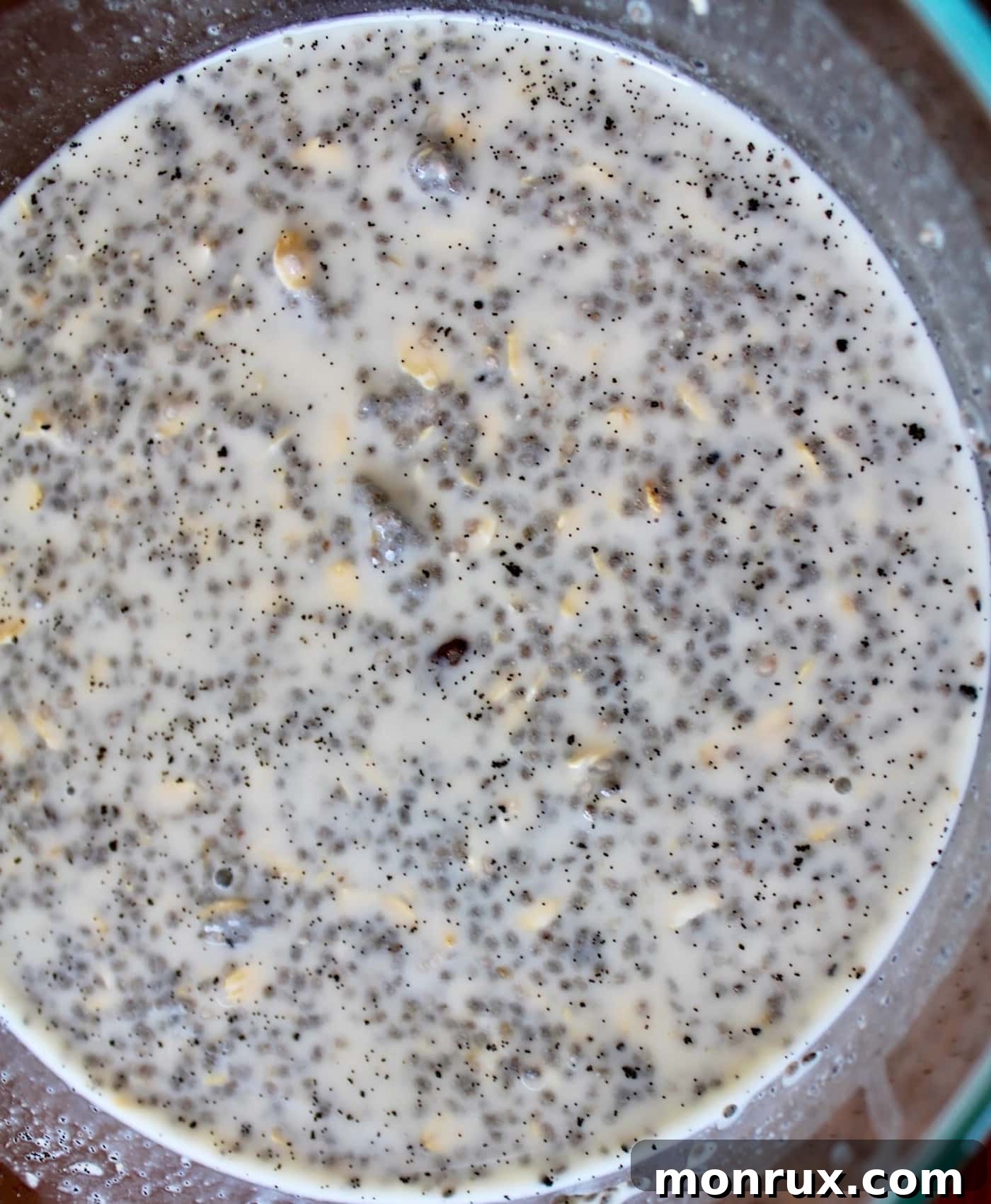 Nutritarian chia pudding recipe in a glass bowl, ready to be refrigerated for an overnight set, illustrating the prep process.