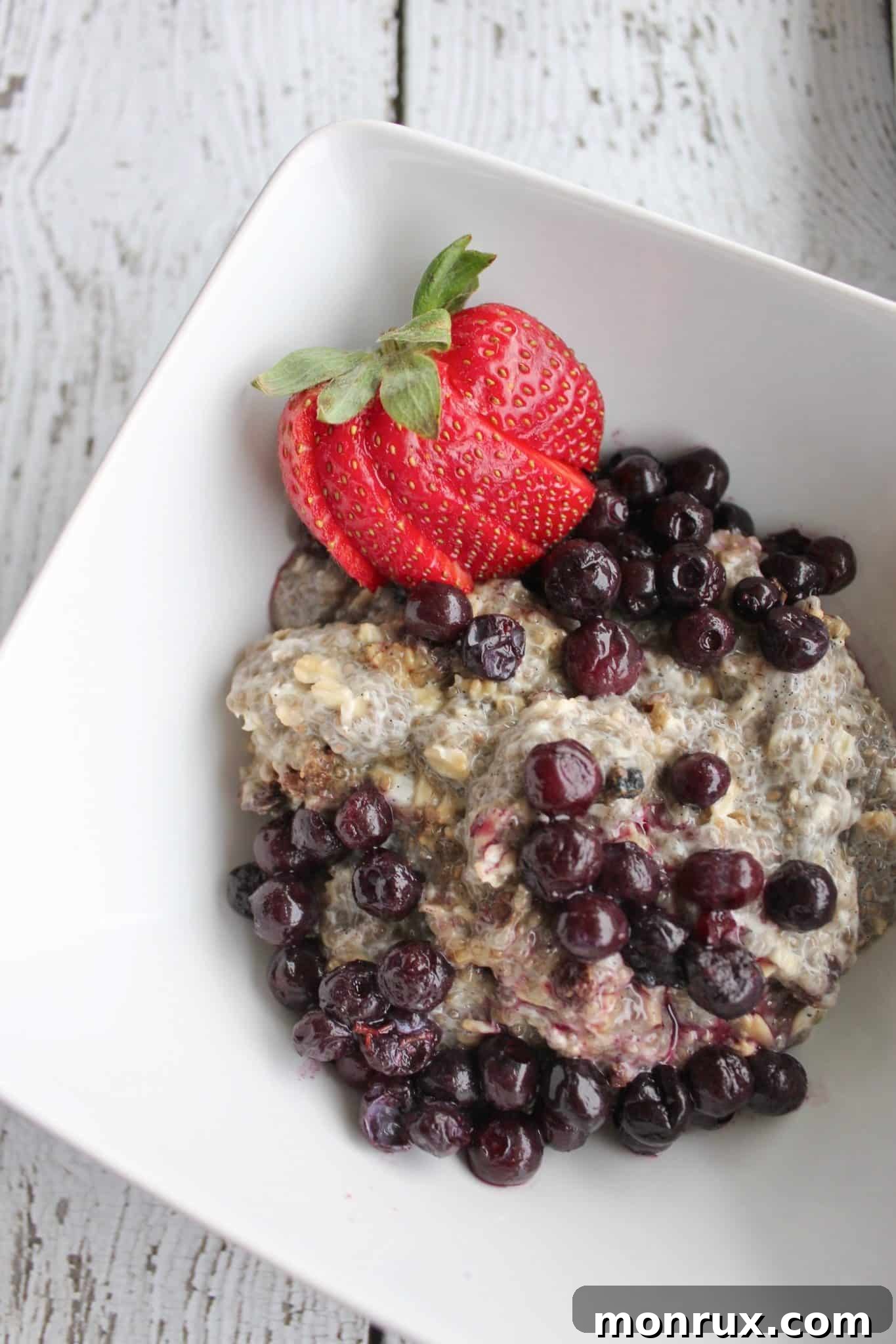 Assembled nutritarian chia pudding, showcasing the layered texture and fresh fruit toppings, emphasizing its visual appeal and readiness.