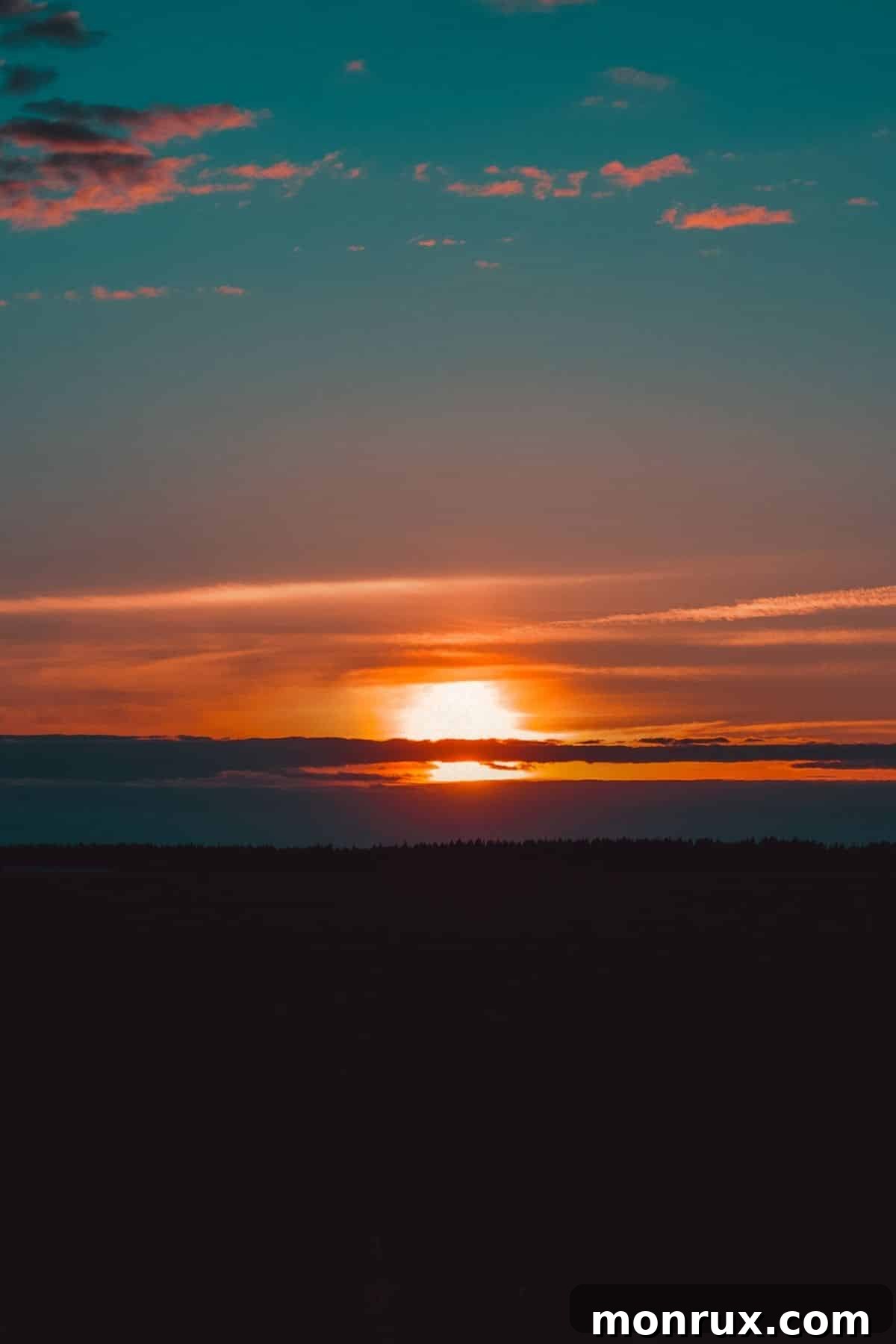 A serene sunset over a vast horizon with a gradient blue sky, symbolizing reflection and new beginnings.