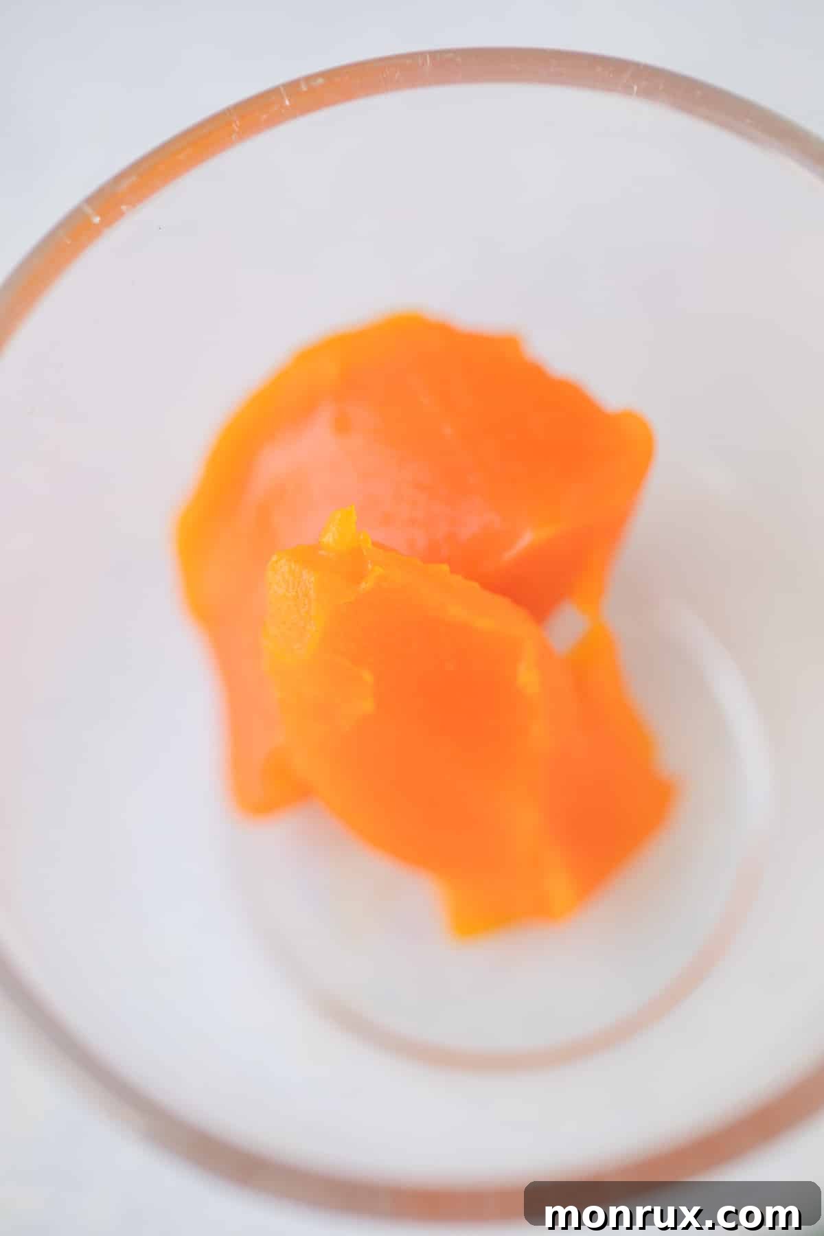 two tablespoons of red palm oil in a bowl
