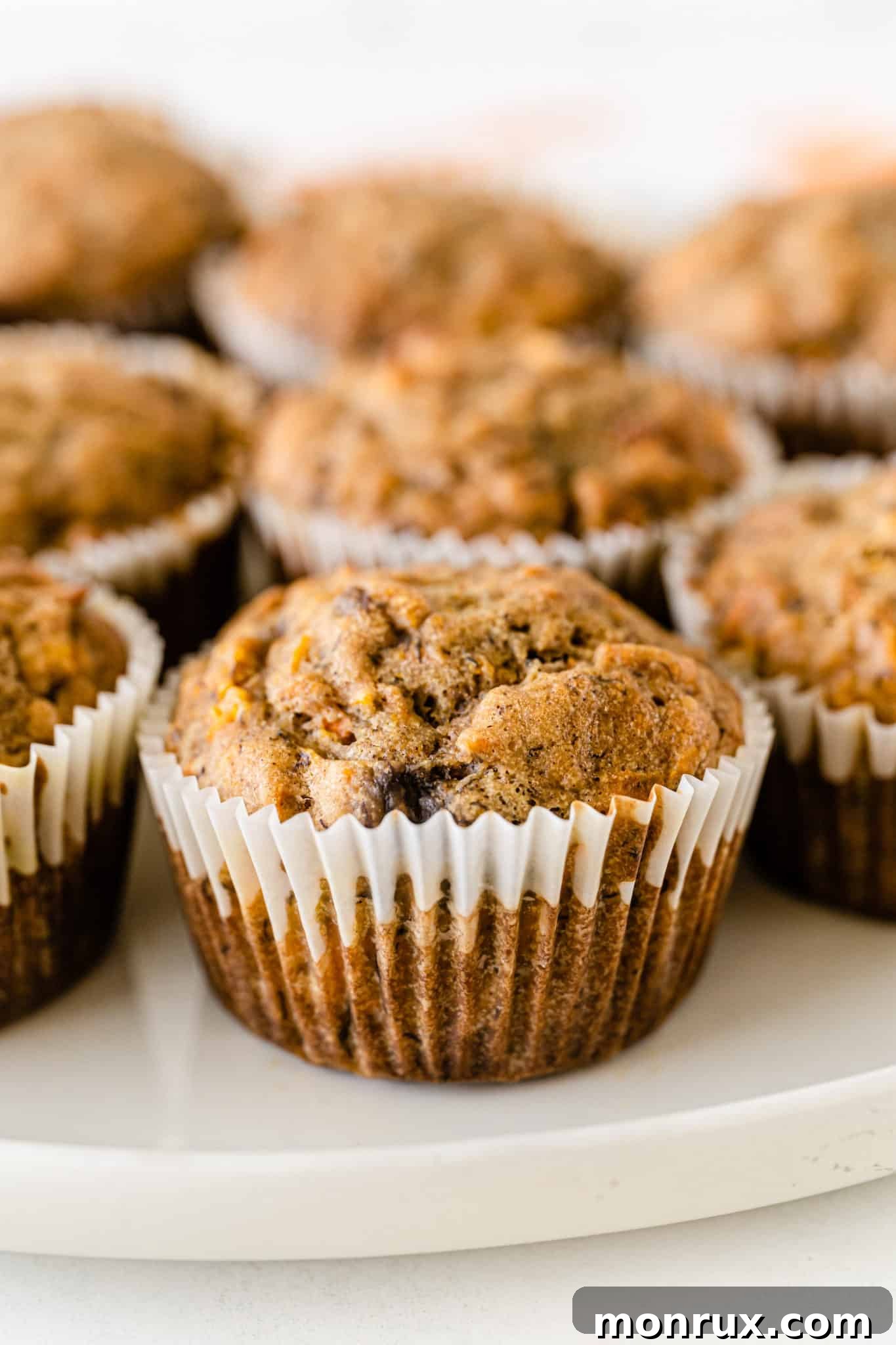 Delicious gluten-free banana carrot muffins served on a rustic plate, ready to be enjoyed as a healthy breakfast or snack.