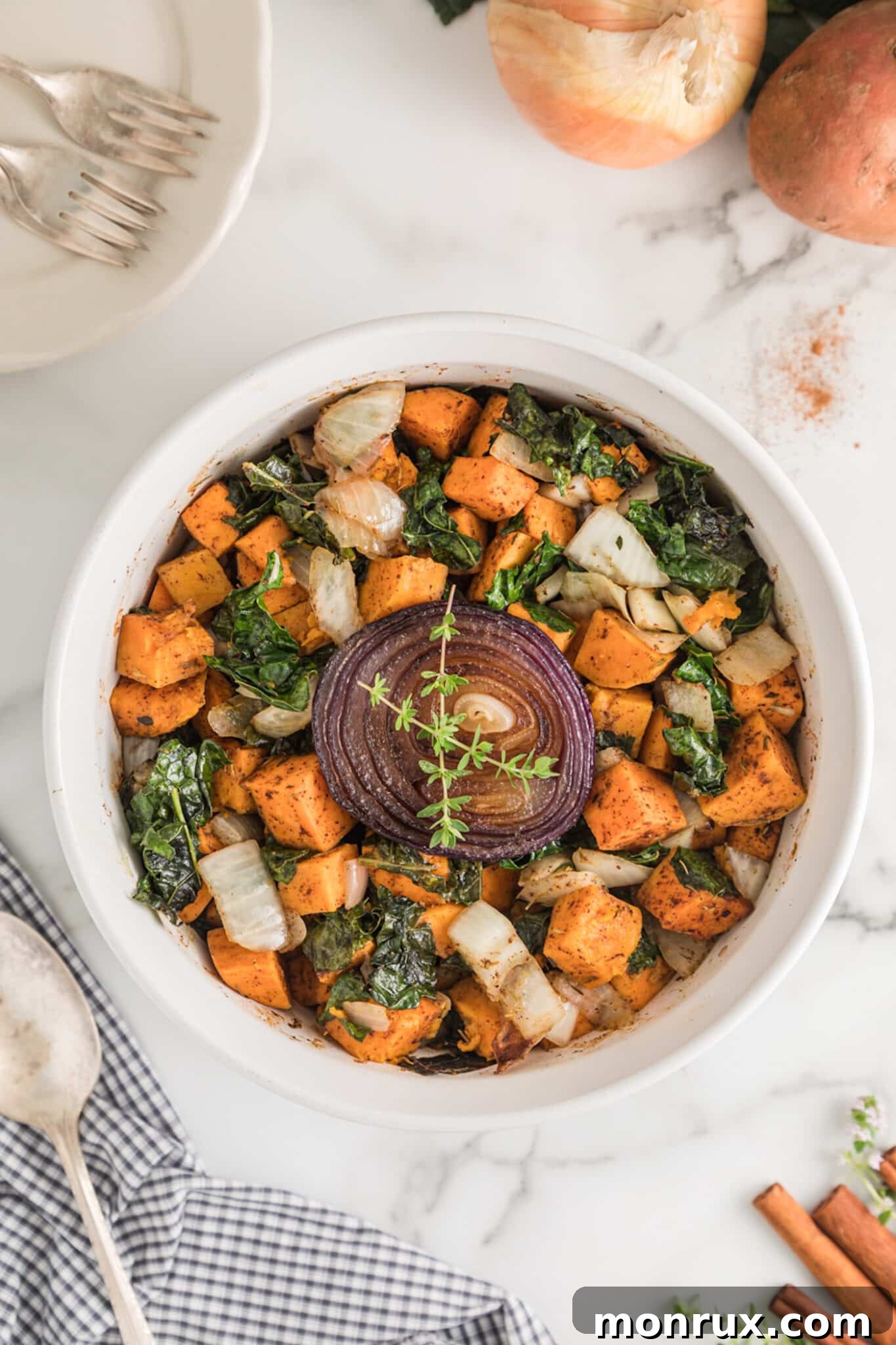 roasted kale and sweet potato with onion on top.