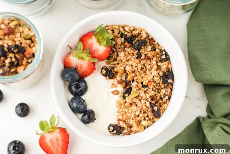 A bowl of yogurt with granola and berries, ready to be enjoyed as a healthy breakfast.