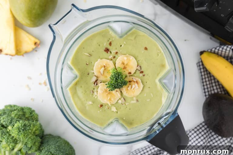 A delicious broccoli pineapple smoothie in a glass, ready to be enjoyed.