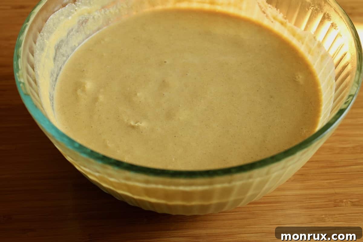 Chilled pumpkin ice cream mixture in a bowl, ready for churning.
