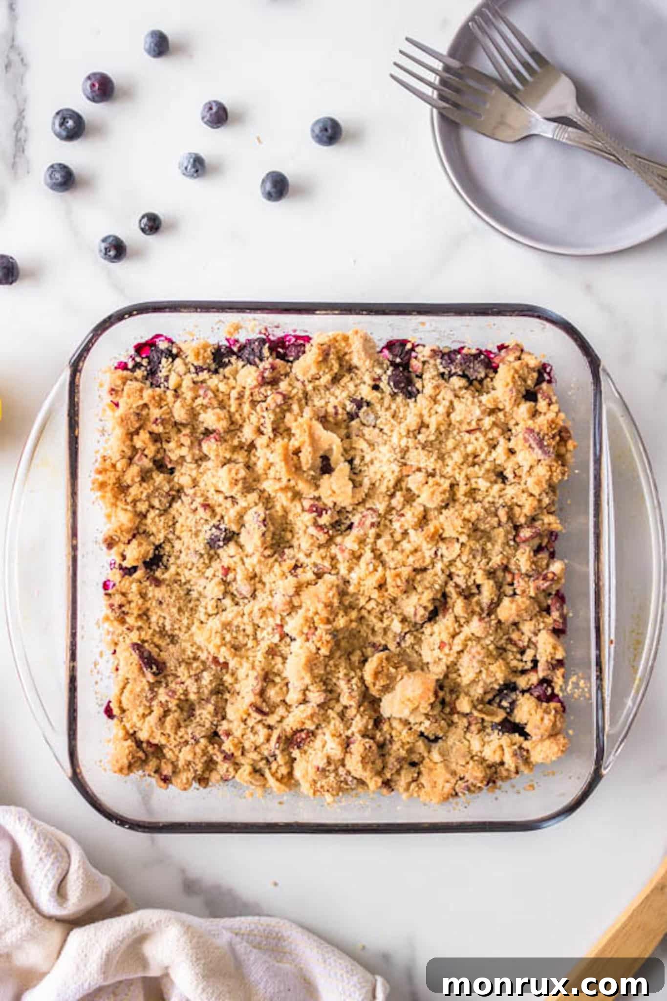 baked blueberry crisp on a table.