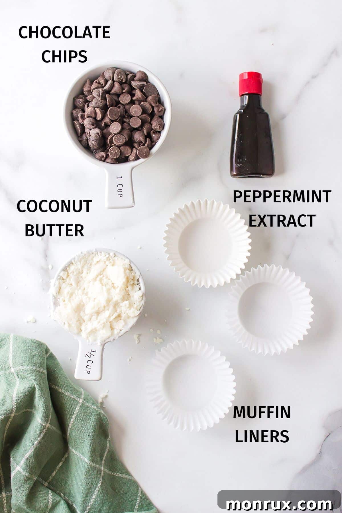 Ingredients for 3-ingredient vegan peppermint patties laid out on a white surface, simple and clean.