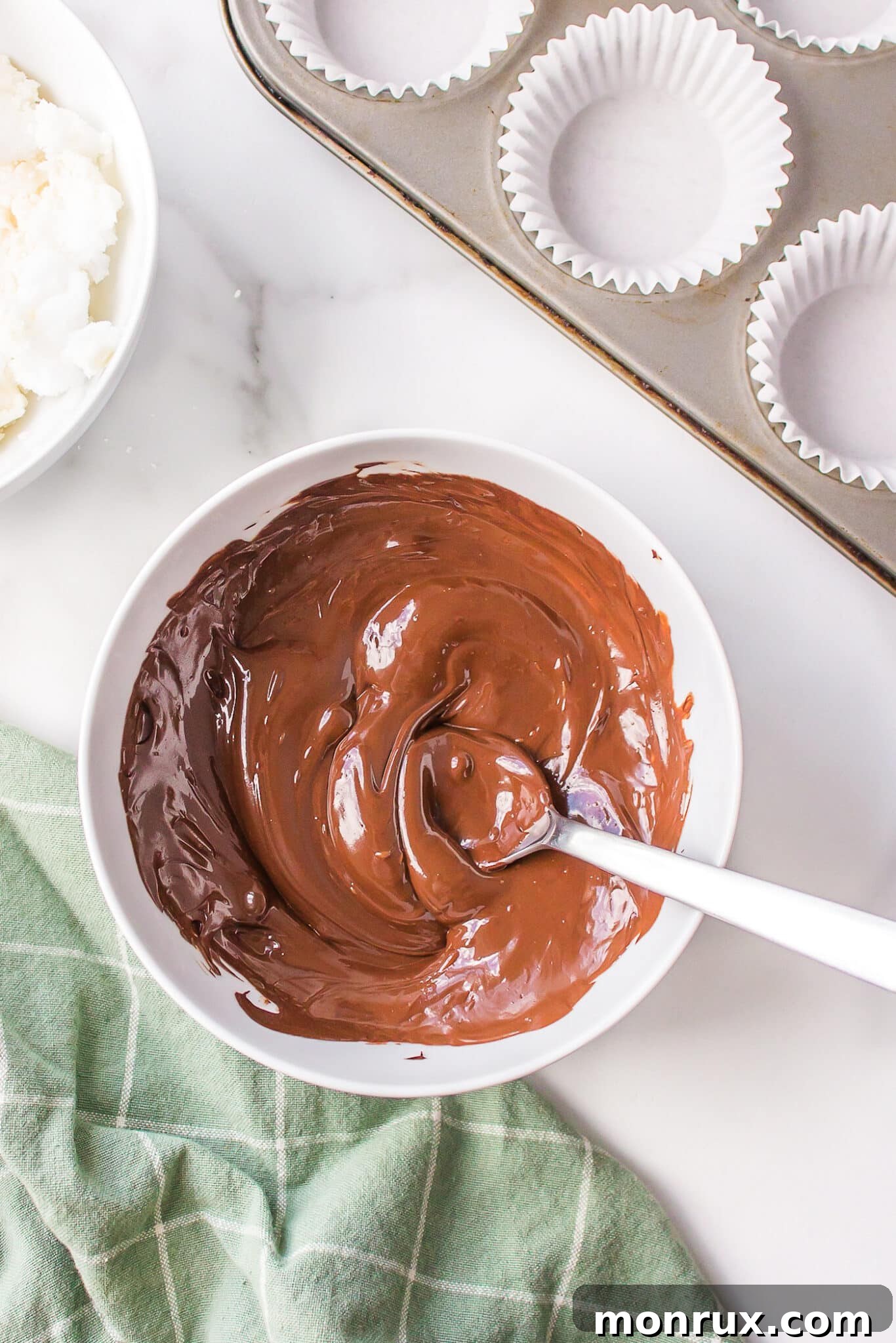 Smooth, glossy melted chocolate ready for the first layer of healthy peppermint patties.