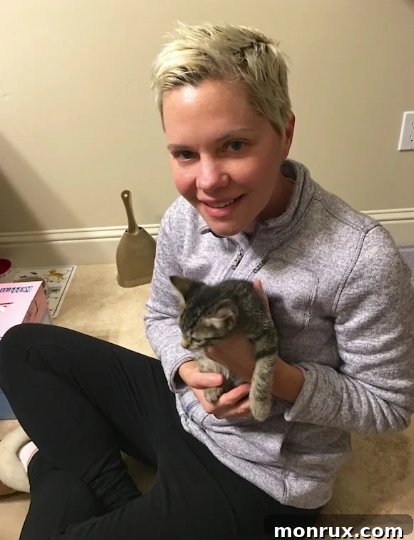 A heartwarming image of Carrie holding Dottie, showing their budding bond.