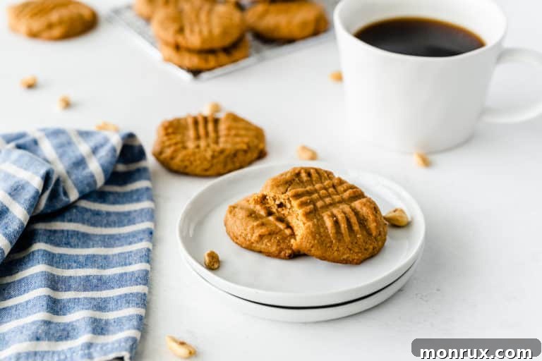 A beautifully arranged plate of golden-brown almond flour peanut butter cookies, ready to be enjoyed.