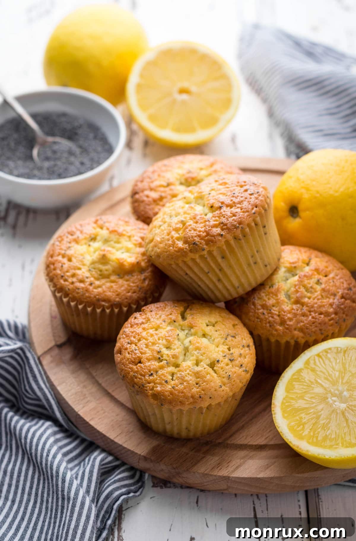 A tray of freshly baked Vegan Lemon Poppy Seed Muffins, ready to be served, showcasing their golden tops and inviting texture.