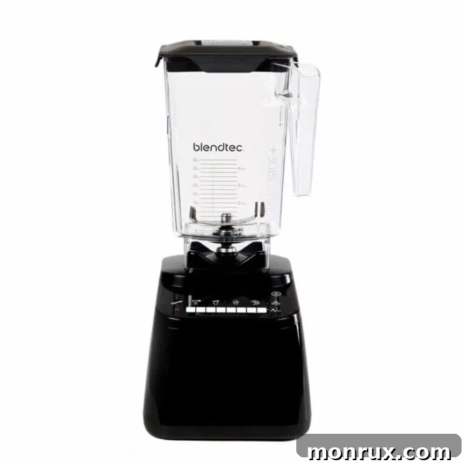 Blendtec blender blending a green smoothie