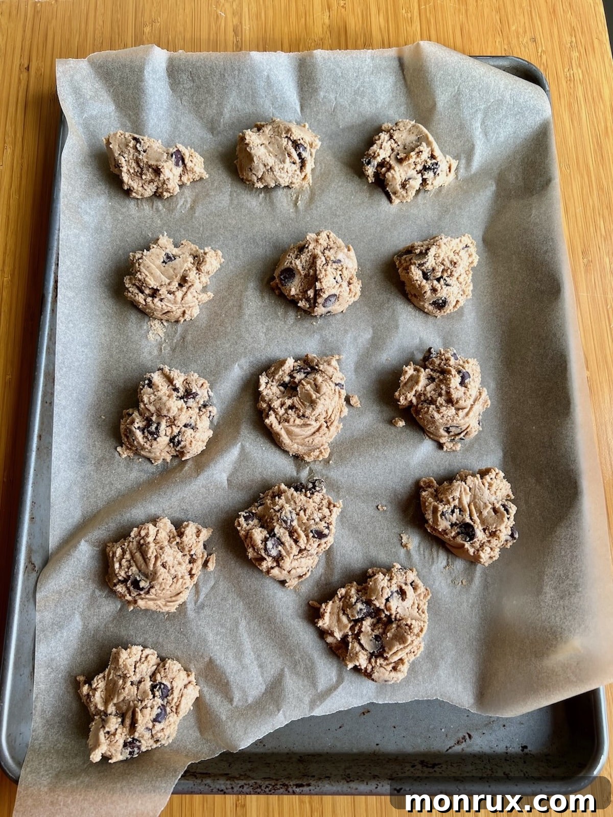 Cassava flour chocolate chip cookies on a baking sheet before baking.