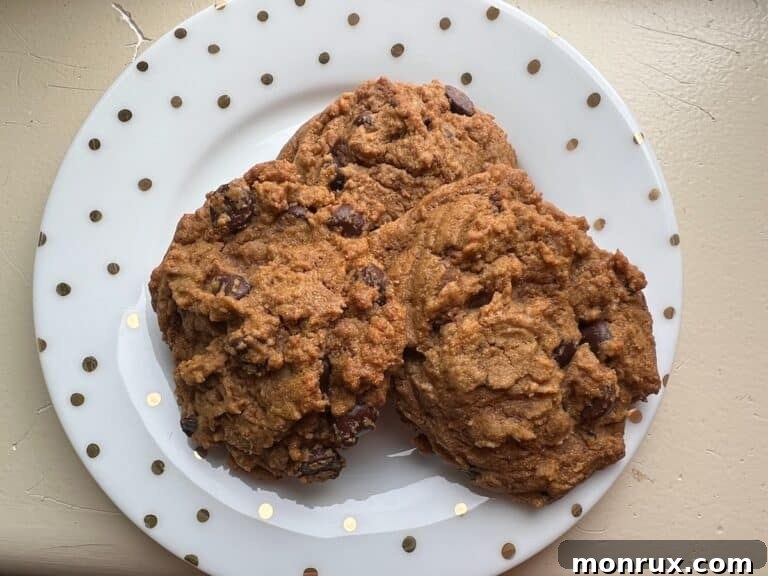 Cassava flour chocolate chip paleo cookies on a cooling rack.