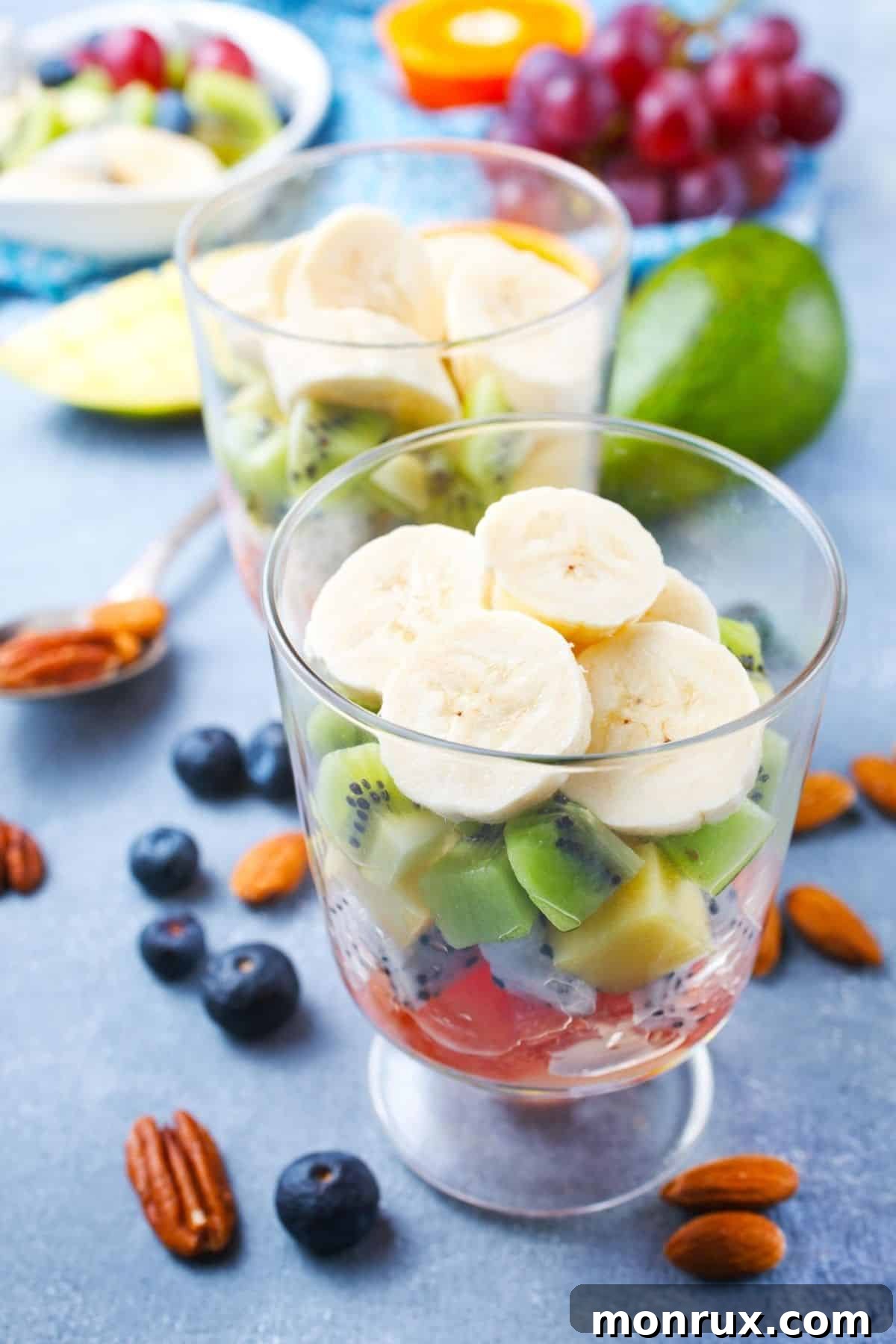 A beautiful collection of fresh fruits served in clear parfait glasses, showcasing a healthy and appealing sweet alternative.