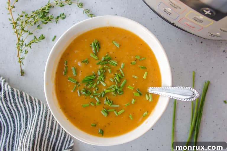 A beautifully presented bowl of creamy potato leek soup, ready to be enjoyed.