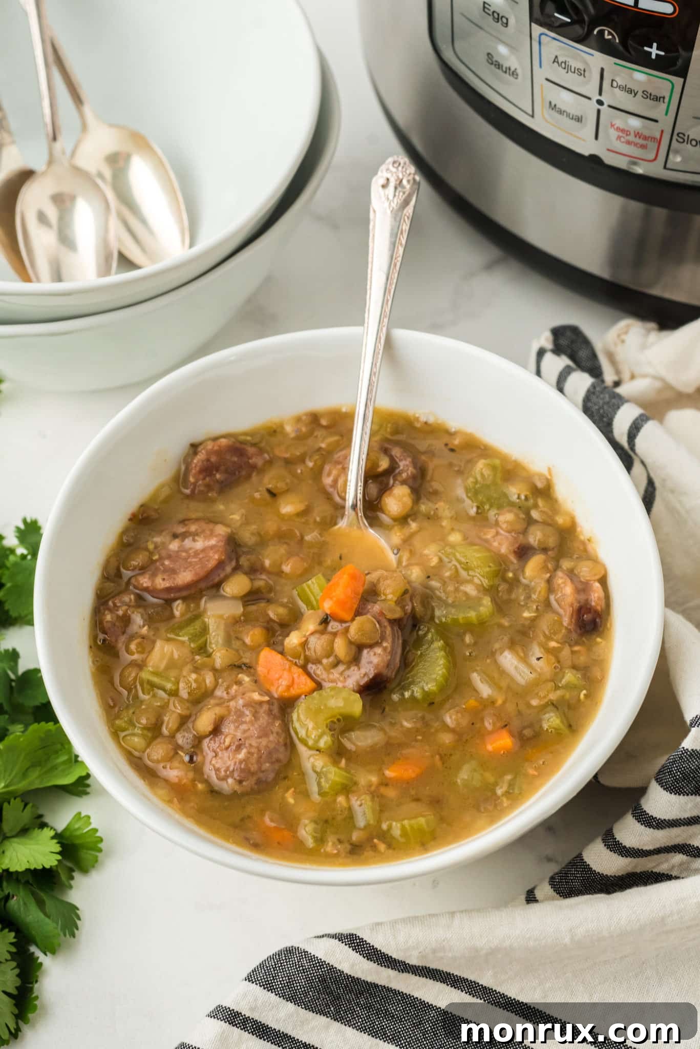 bowl of instant pot lentil soup with sausage.