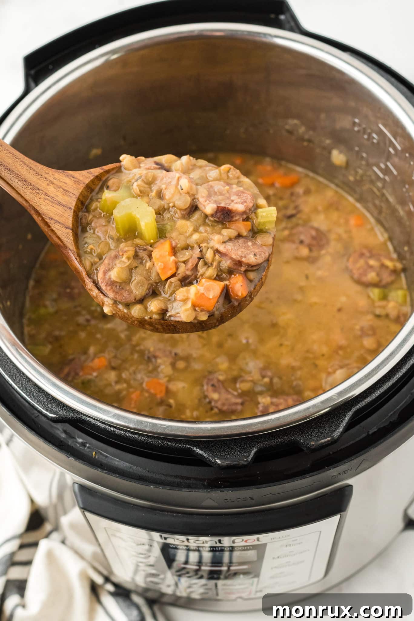 spoonful of instant pot lentil soup with sausage.