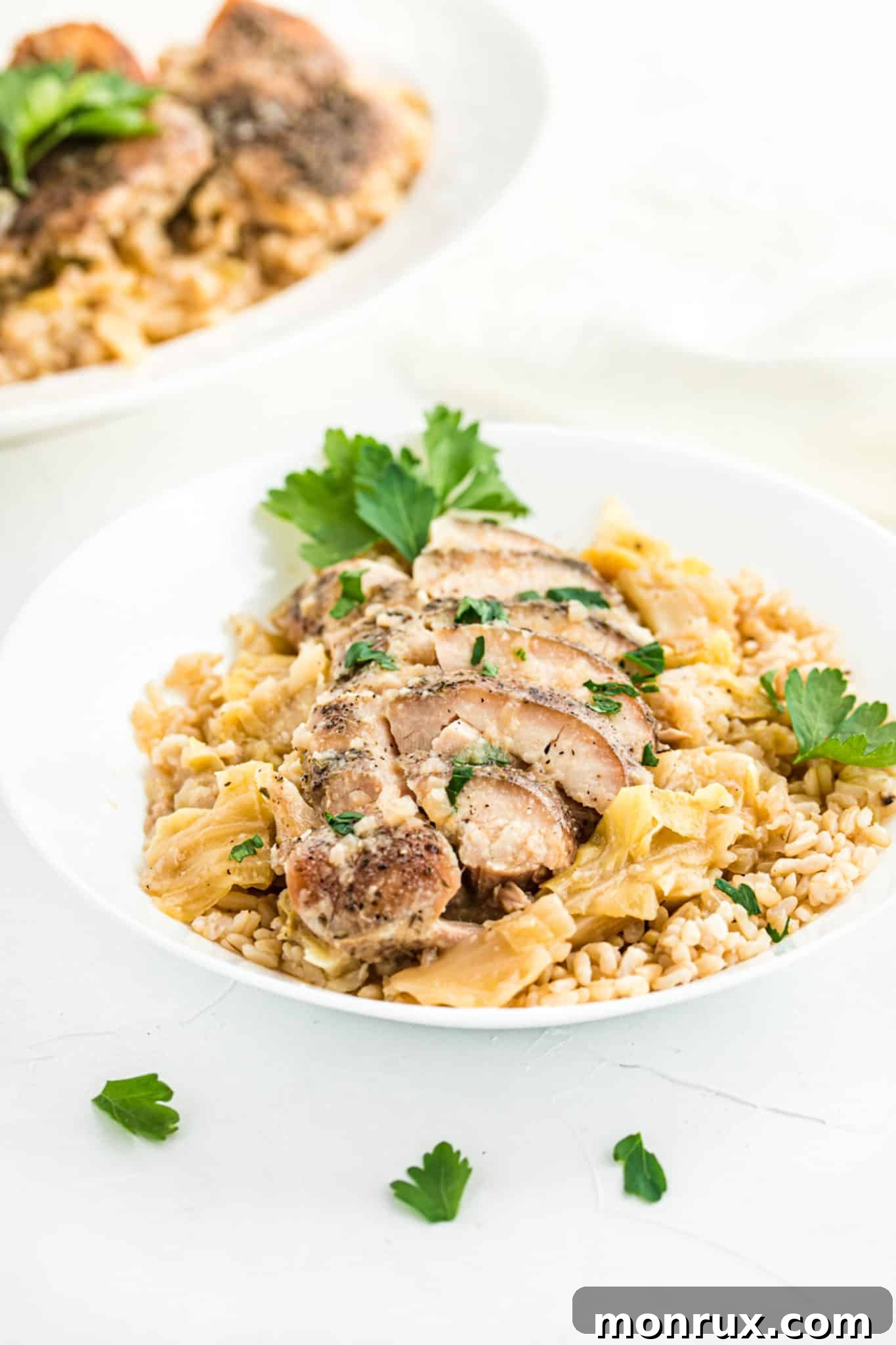 Flavorful keto chicken thighs served with tender cooked cabbage and fluffy cauliflower rice, ready for a healthy meal.