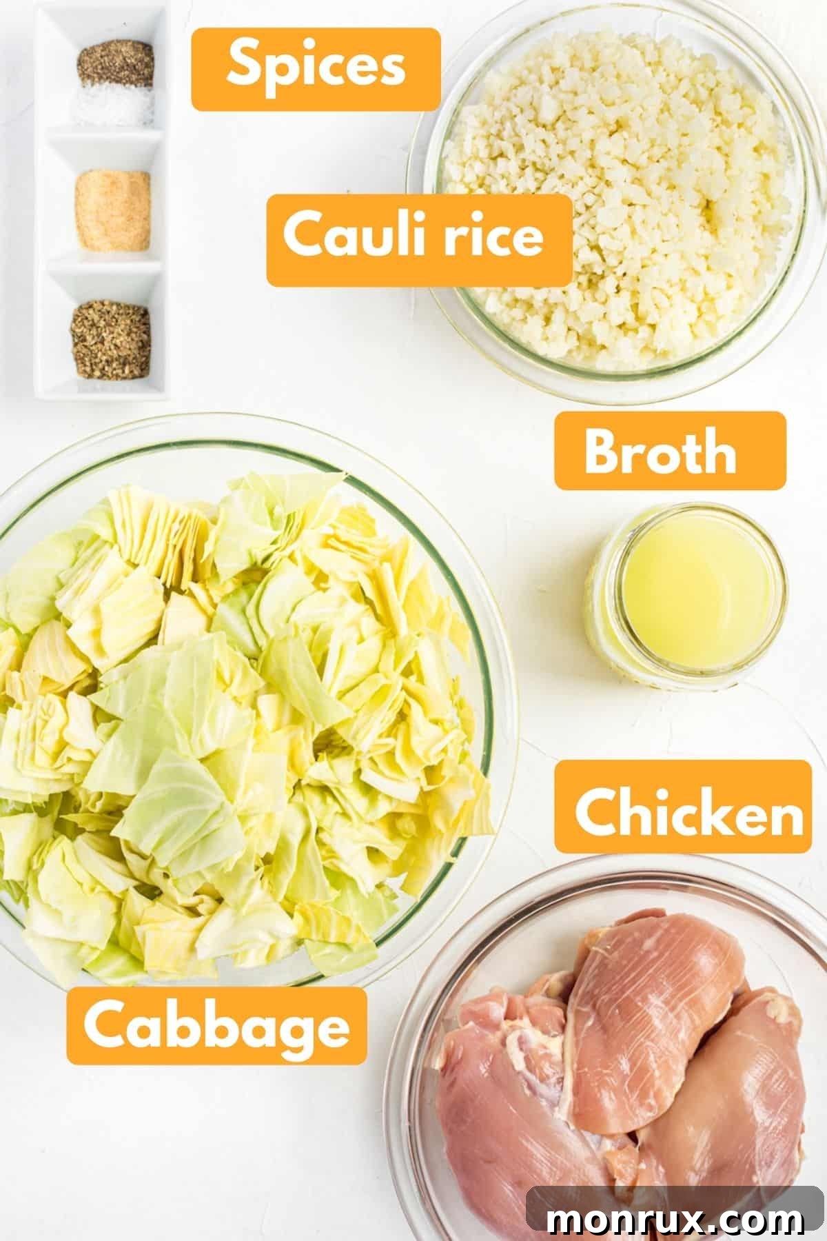 Photo displaying labeled ingredients for a delicious keto crockpot chicken thigh recipe, including chicken thighs, cabbage, cauliflower rice, and seasonings.