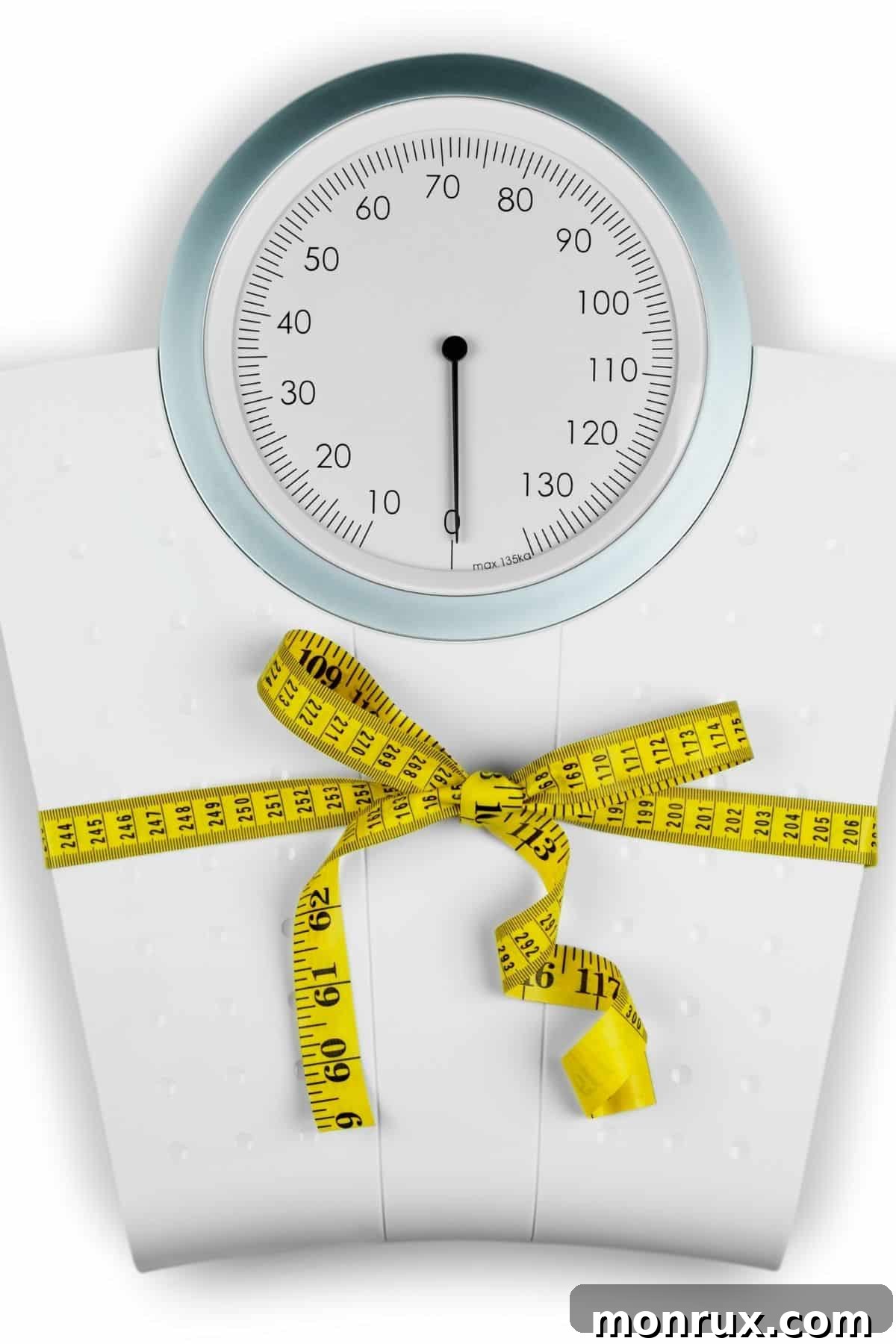 White scale tied with a yellow measuring tape, symbolizing the challenge and measurement of weight loss.
