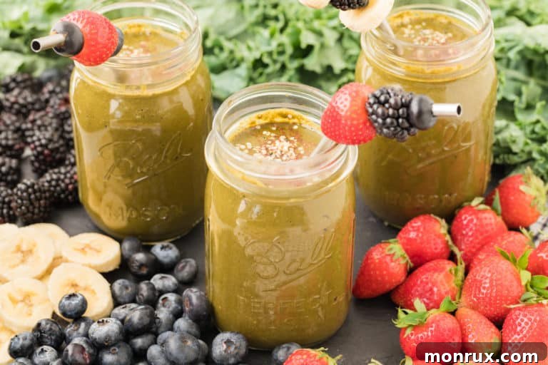 Collard Green Smoothie served in two elegant glasses, showcasing its creamy texture.