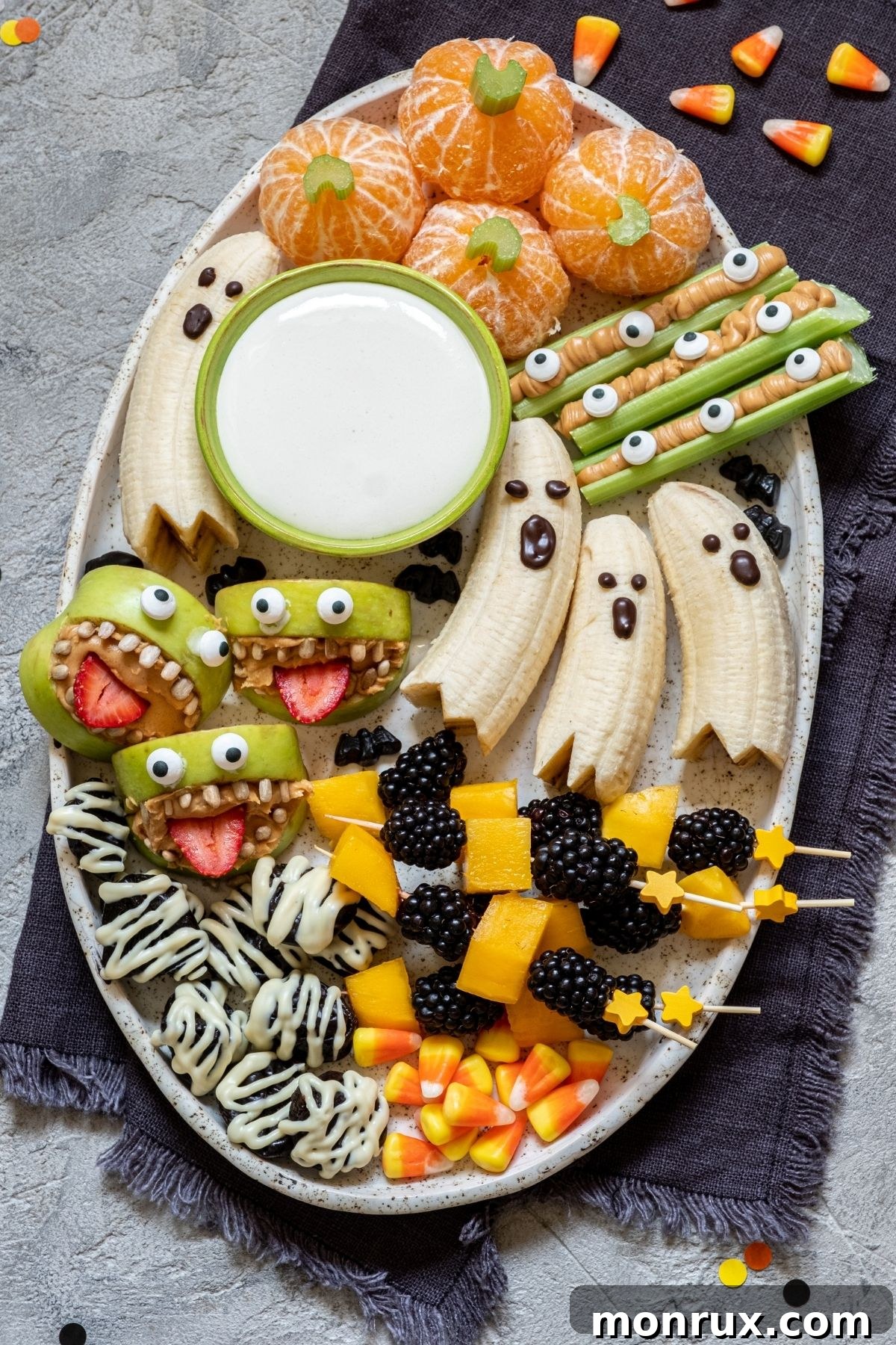 A healthy Halloween snack tray featuring an array of spooky, homemade goodies, all vegan and gluten-free.