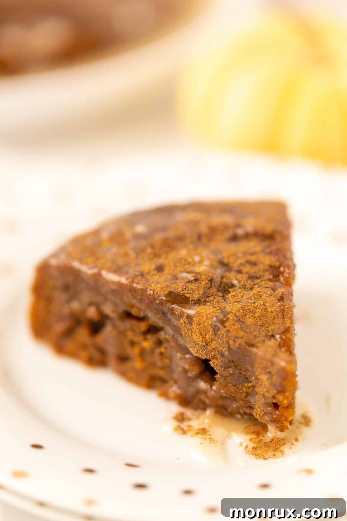 A perfectly portioned slice of Instant Pot Pumpkin Spice Cake, elegantly presented on a plate, ready to be enjoyed.