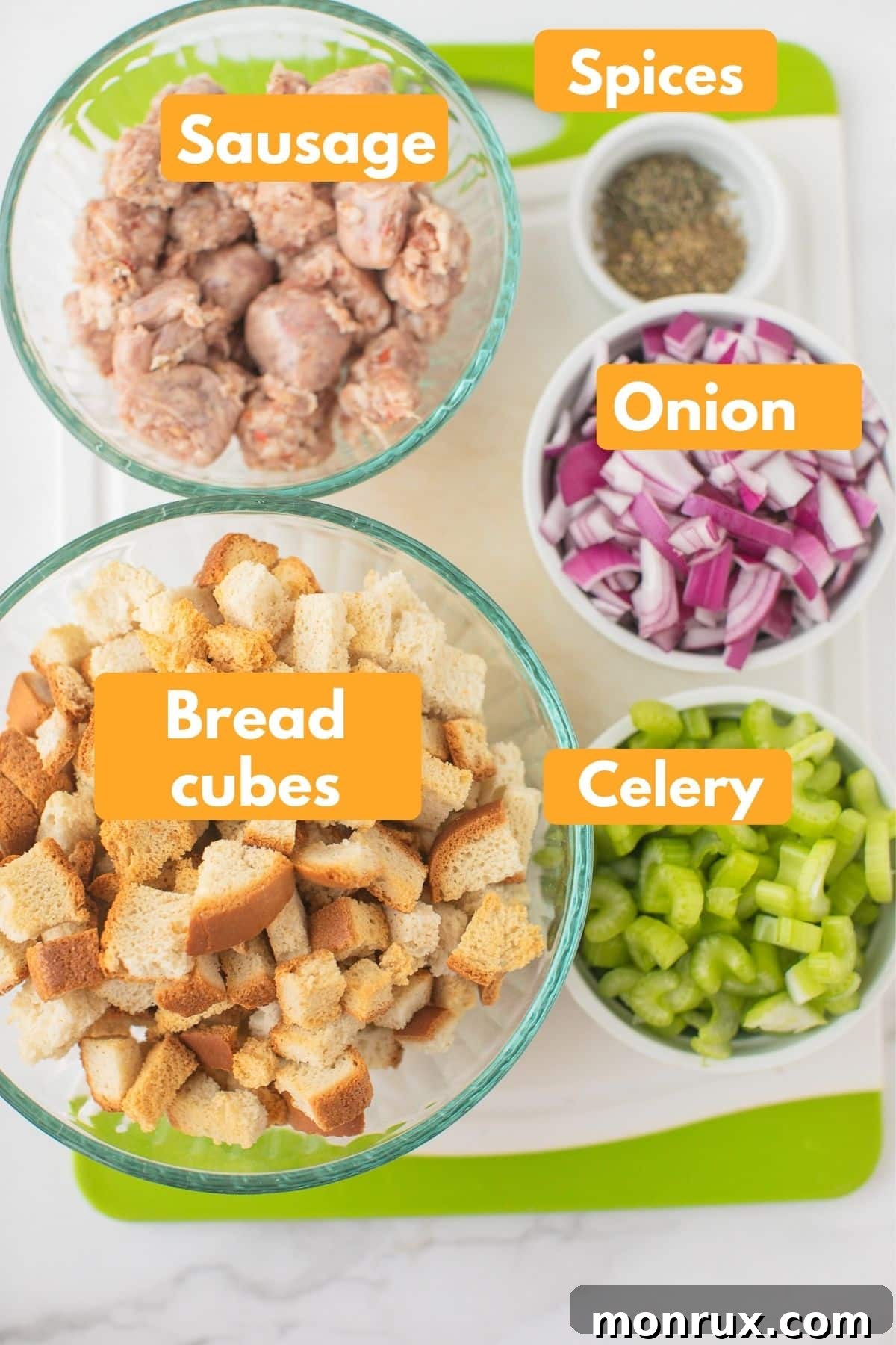 Labeled photo showcasing essential ingredients for Instant Pot sausage stuffing: bread cubes, sausage, celery, onion, broth, and herbs.