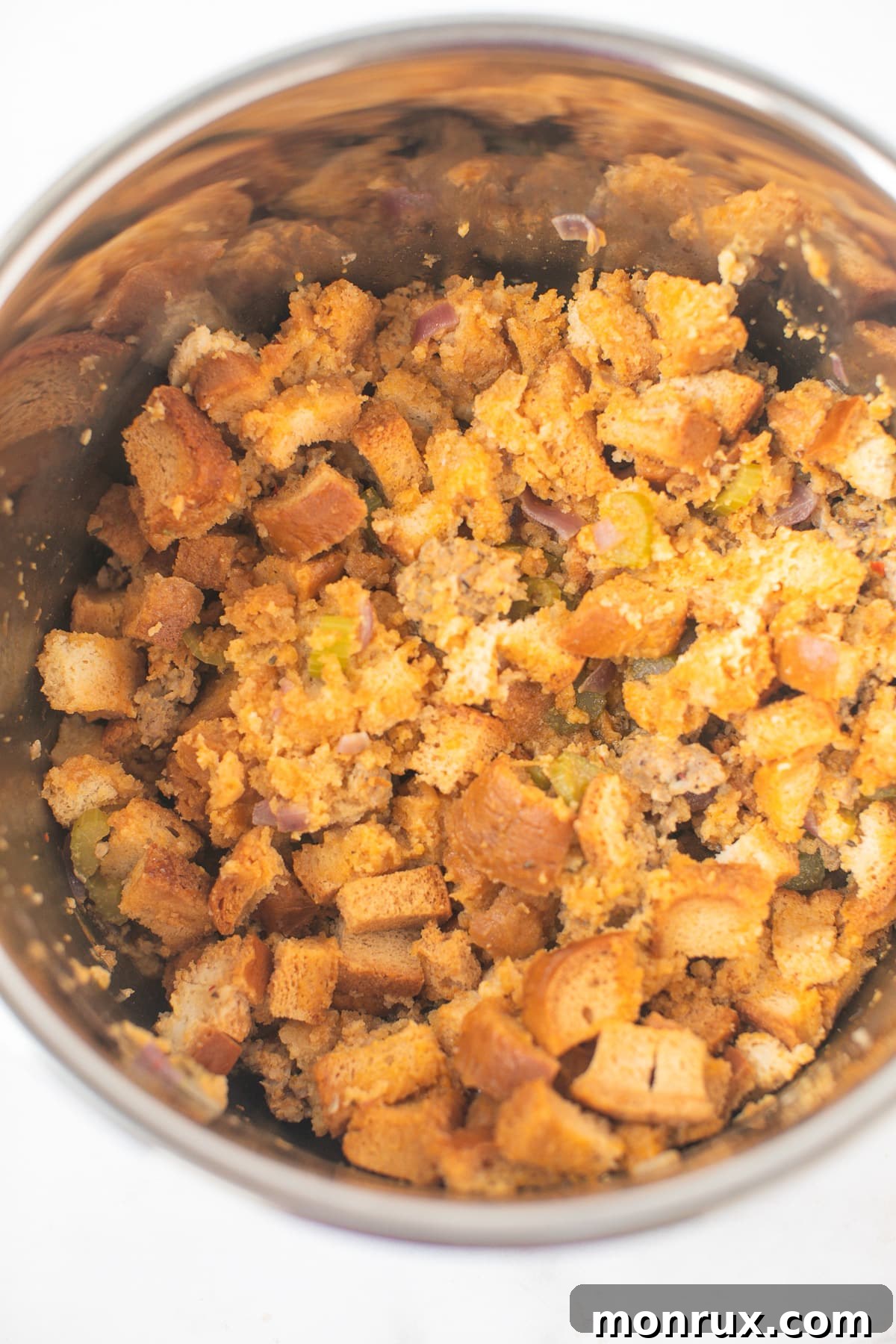 All the delicious stuffing ingredients, layered and ready for pressure cooking in the Instant Pot.
