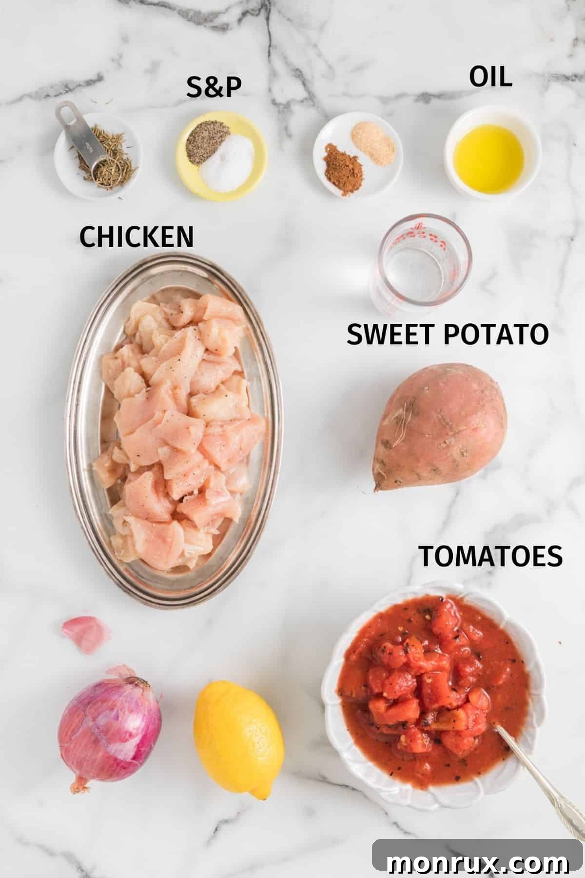 Ingredients for Sweet Potato Chicken, including chopped chicken, sweet potatoes, canned tomatoes, and spices, arranged in small bowls on a white surface.