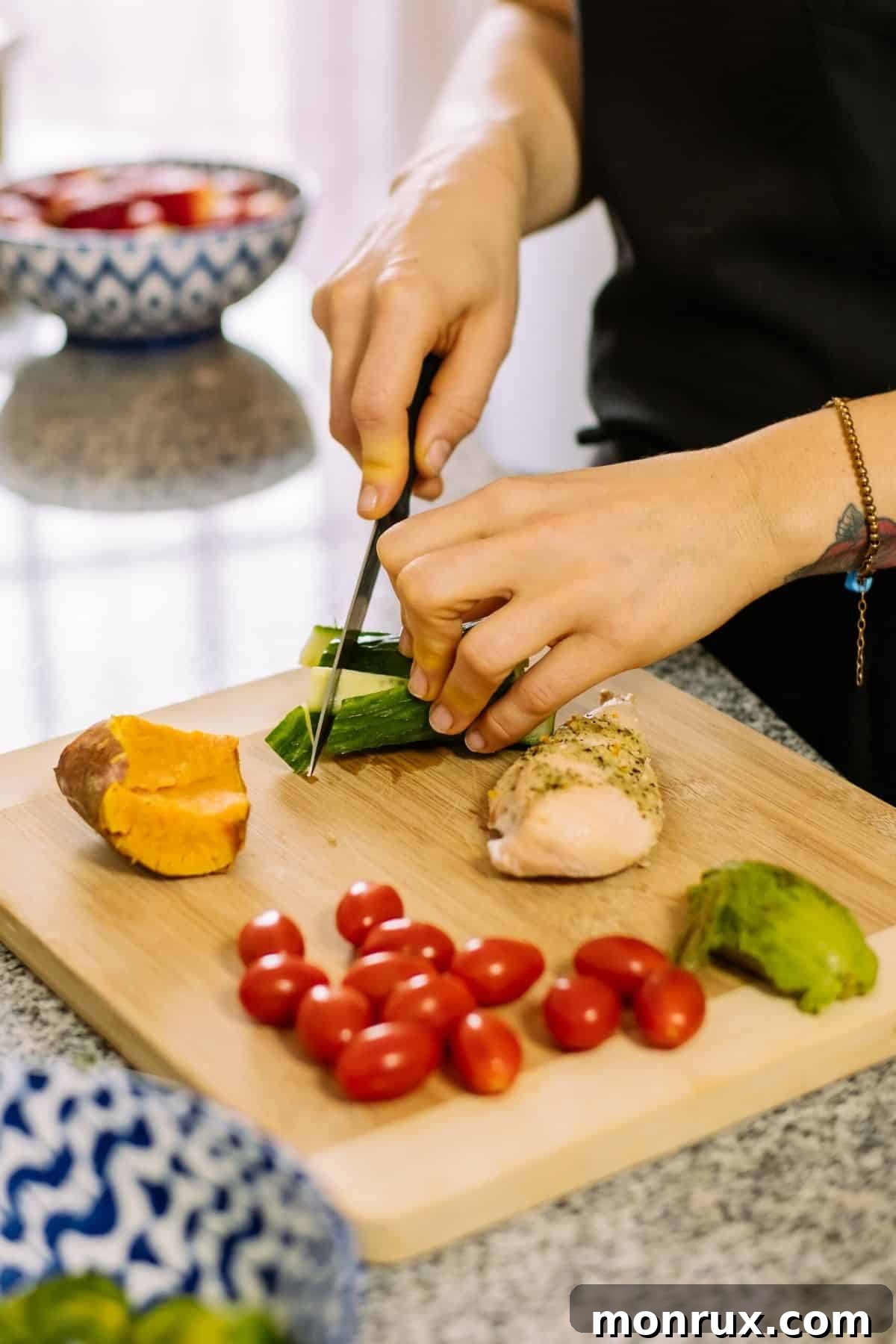 Woman efficiently prepping a variety of vegetables on a wooden cutting board, showcasing organization.