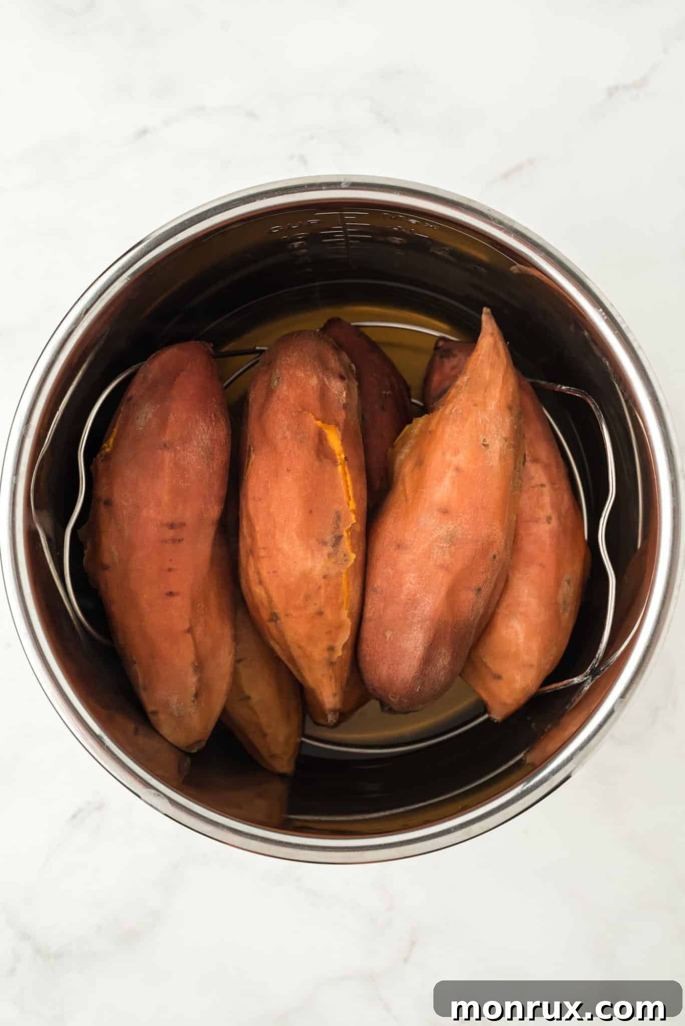 Baked sweet potatoes inside a pressure cooker, perfectly cooked.