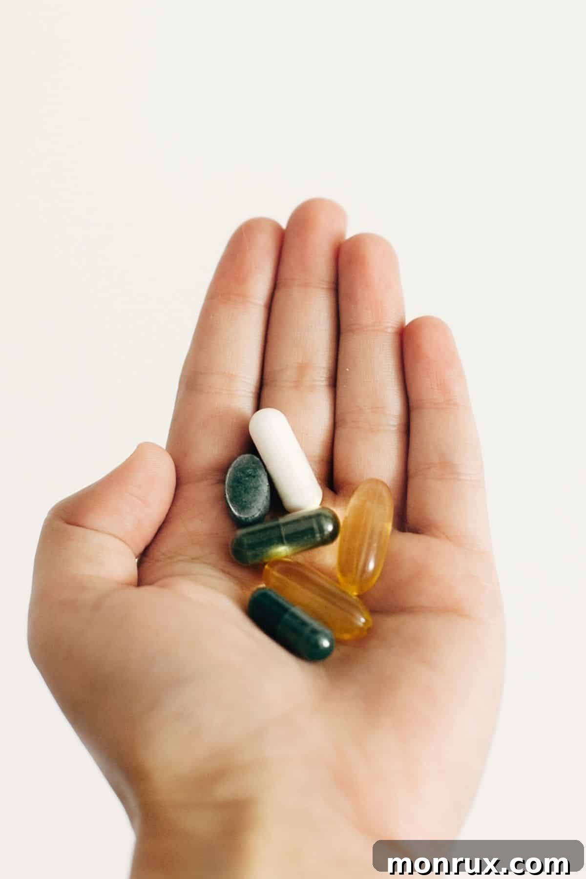 A woman holding a bottle of supplements, possibly glutamine, to illustrate nutritional support during a detox.