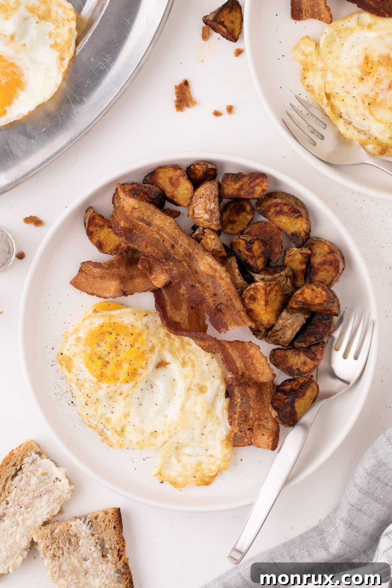 A satisfying breakfast of over medium eggs served with crispy bacon, highlighting protein-rich options.