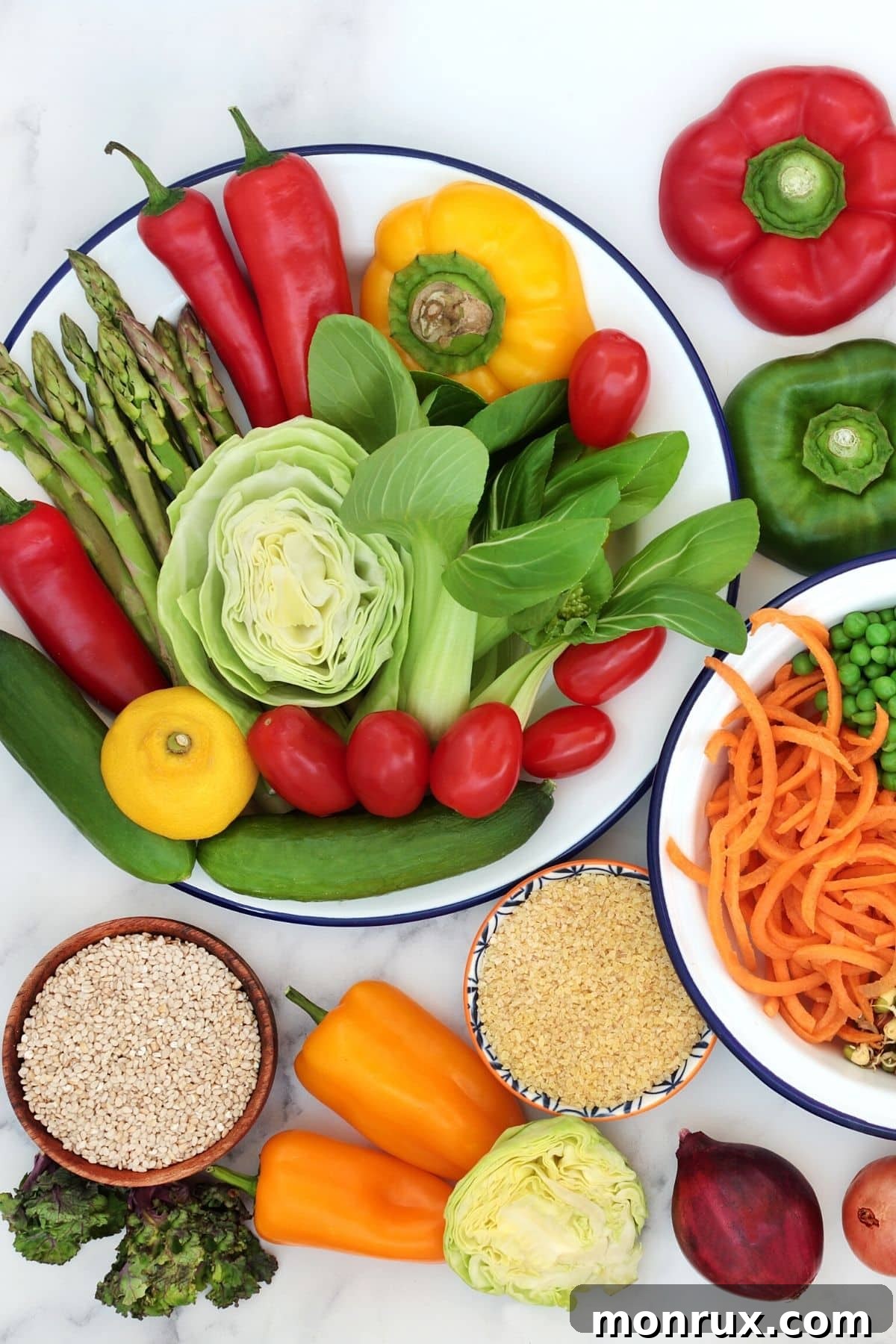 A variety of healthy, low histamine foods arranged on a tabletop, including fresh produce and whole grains.