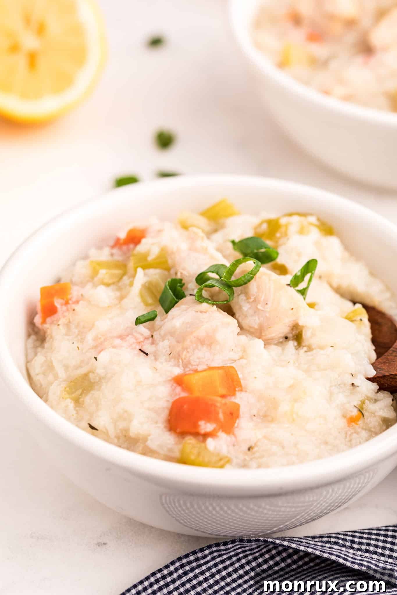Instant Pot Chicken Rice Soup with a vibrant lemon wedge garnish.