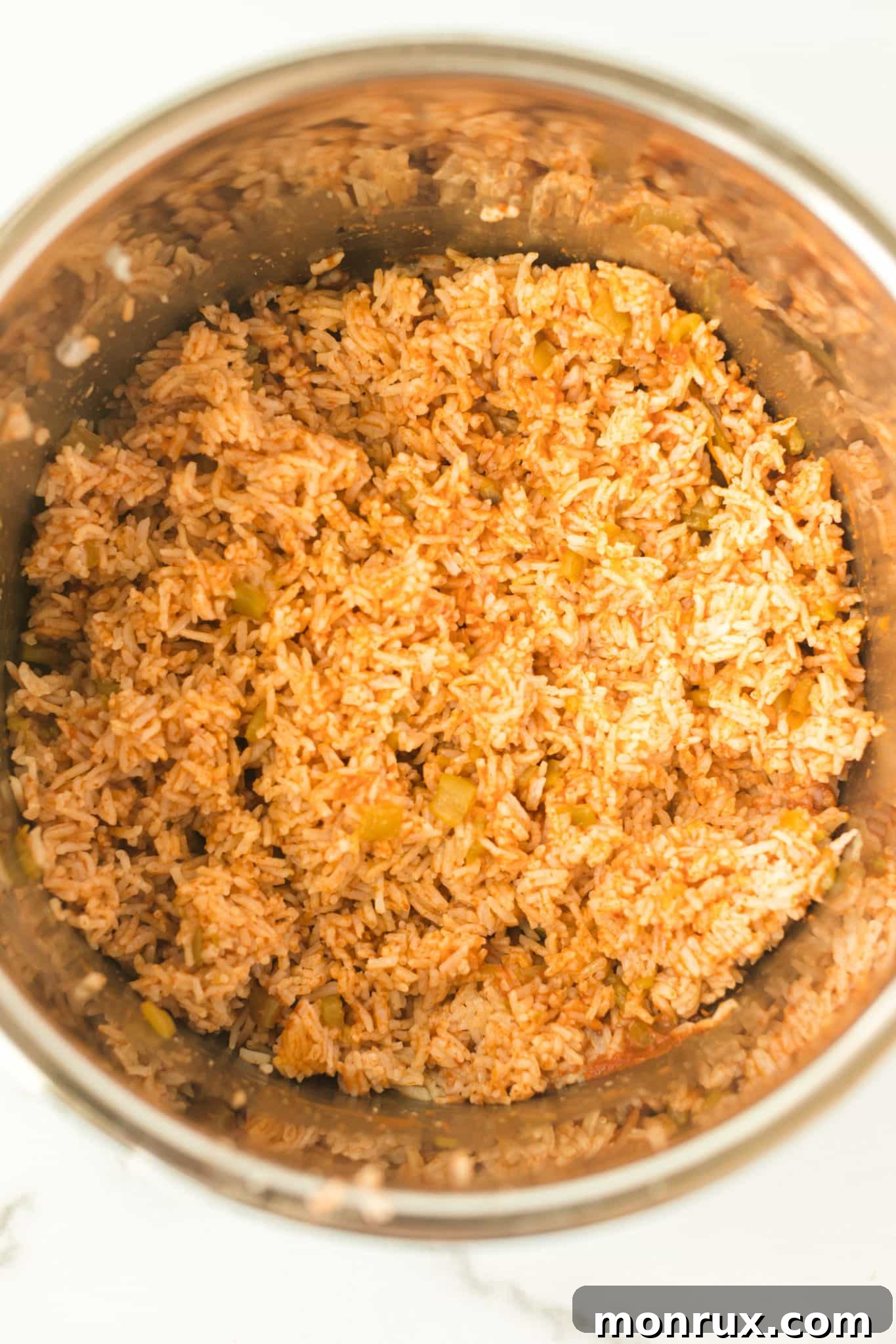 Perfectly cooked Mexican rice inside the Instant Pot, ready to be fluffed.