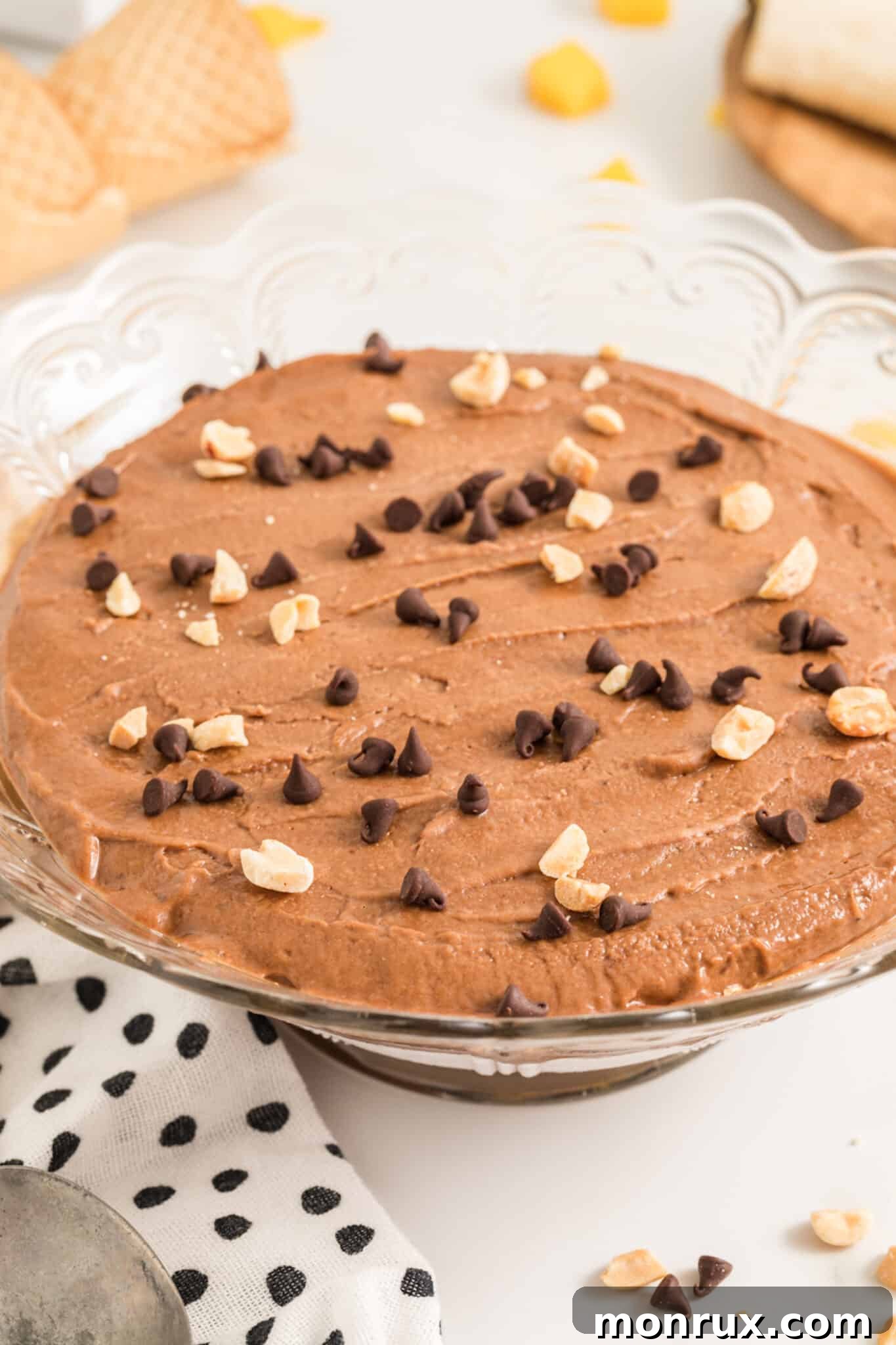 A delicious Chocolate Peanut Butter Banana Ice Cream pie, sliced and ready to serve, showing its rich, creamy texture.