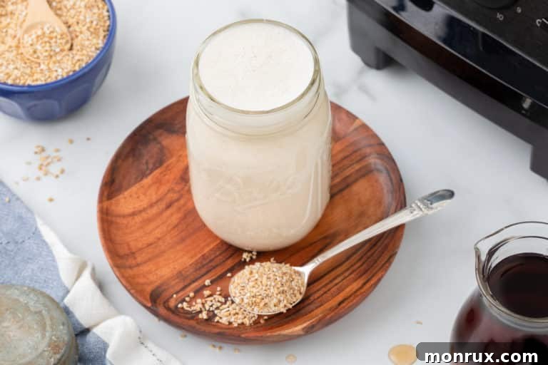 A jar of homemade oat milk creamer on a rustic table.