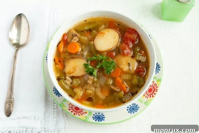 A hearty bowl of Instant Pot Vegetable Soup, packed with colorful veggies and potatoes.