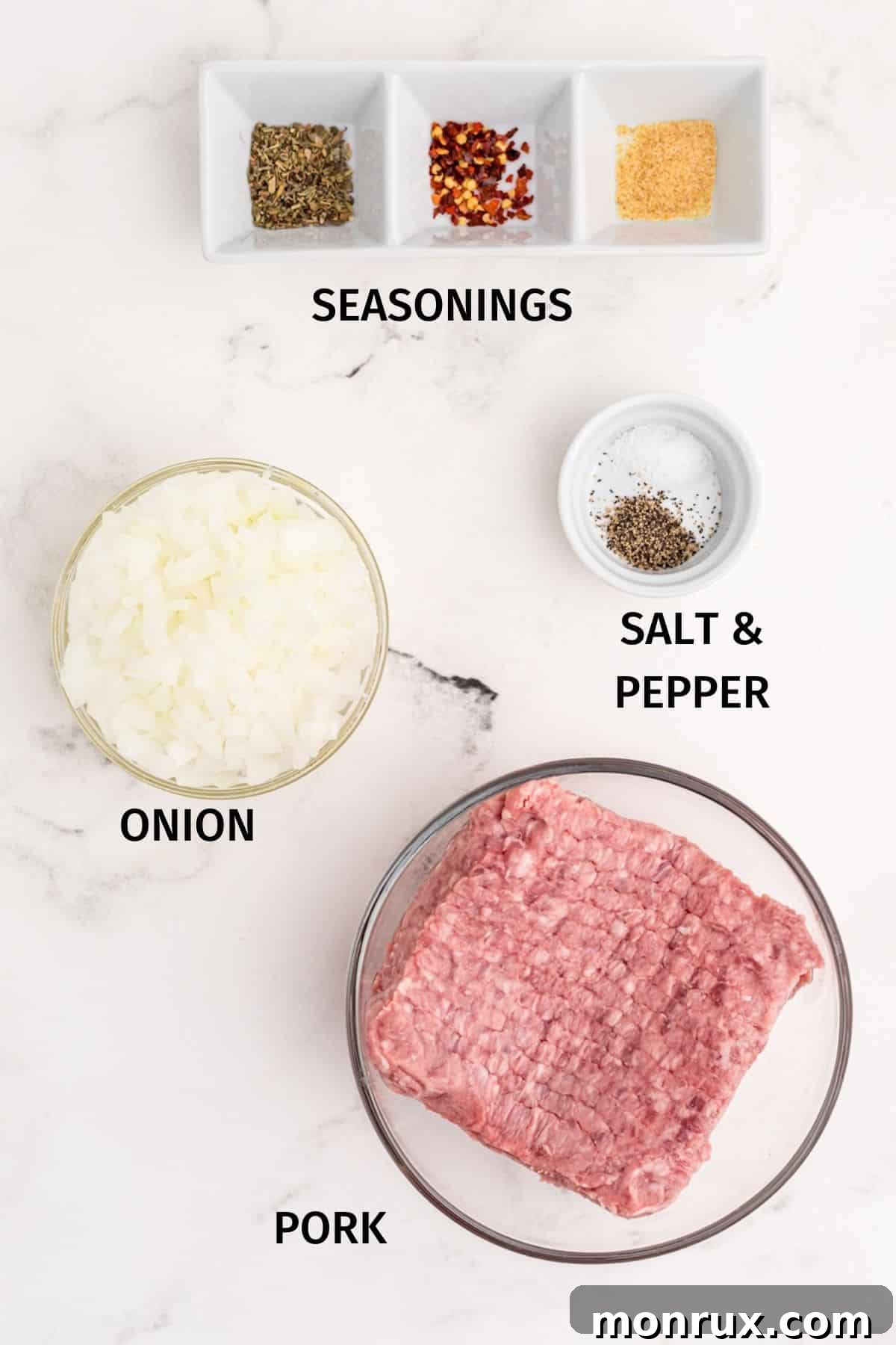 ingredients for baked pork meatballs laid out on a cutting board