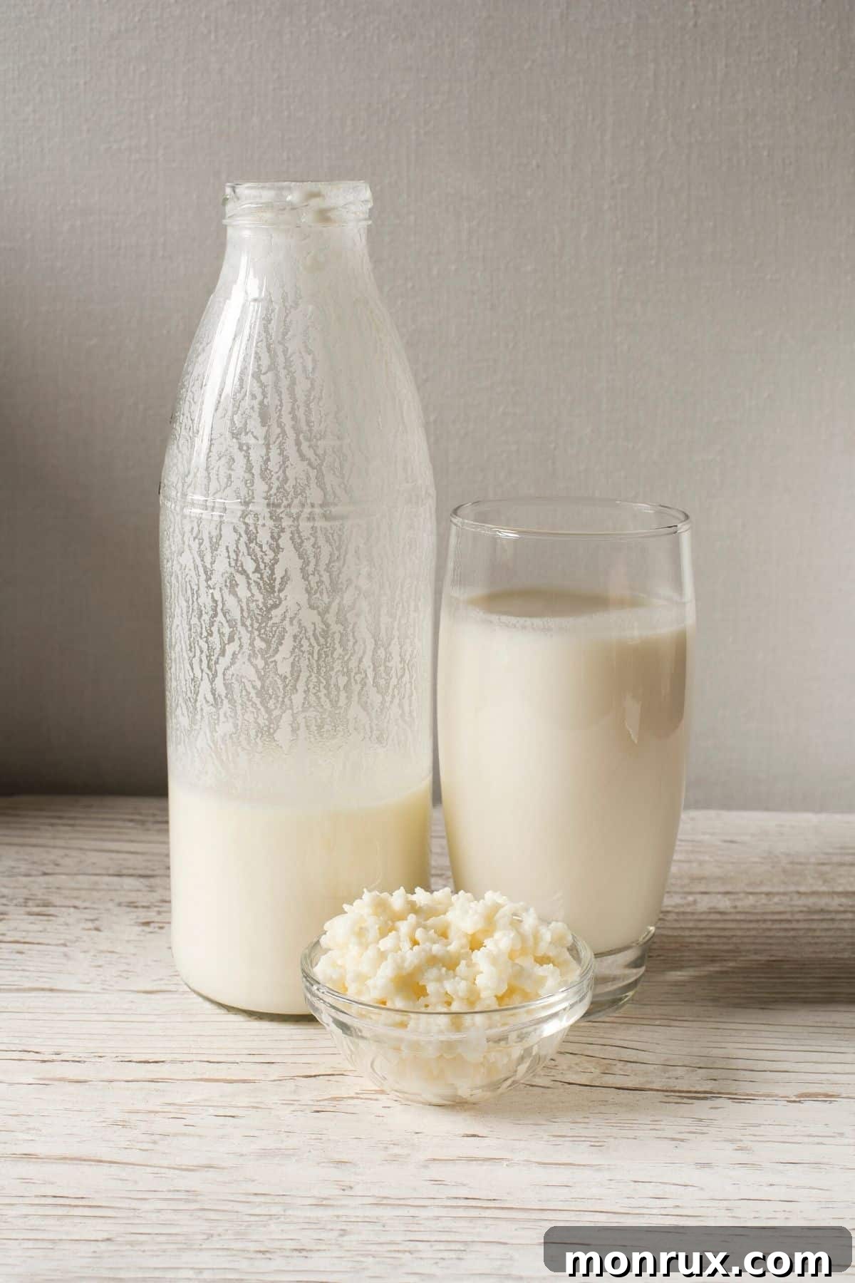 A glass jar filled with creamy, white kefir, suggesting its rich texture and nourishing qualities.
