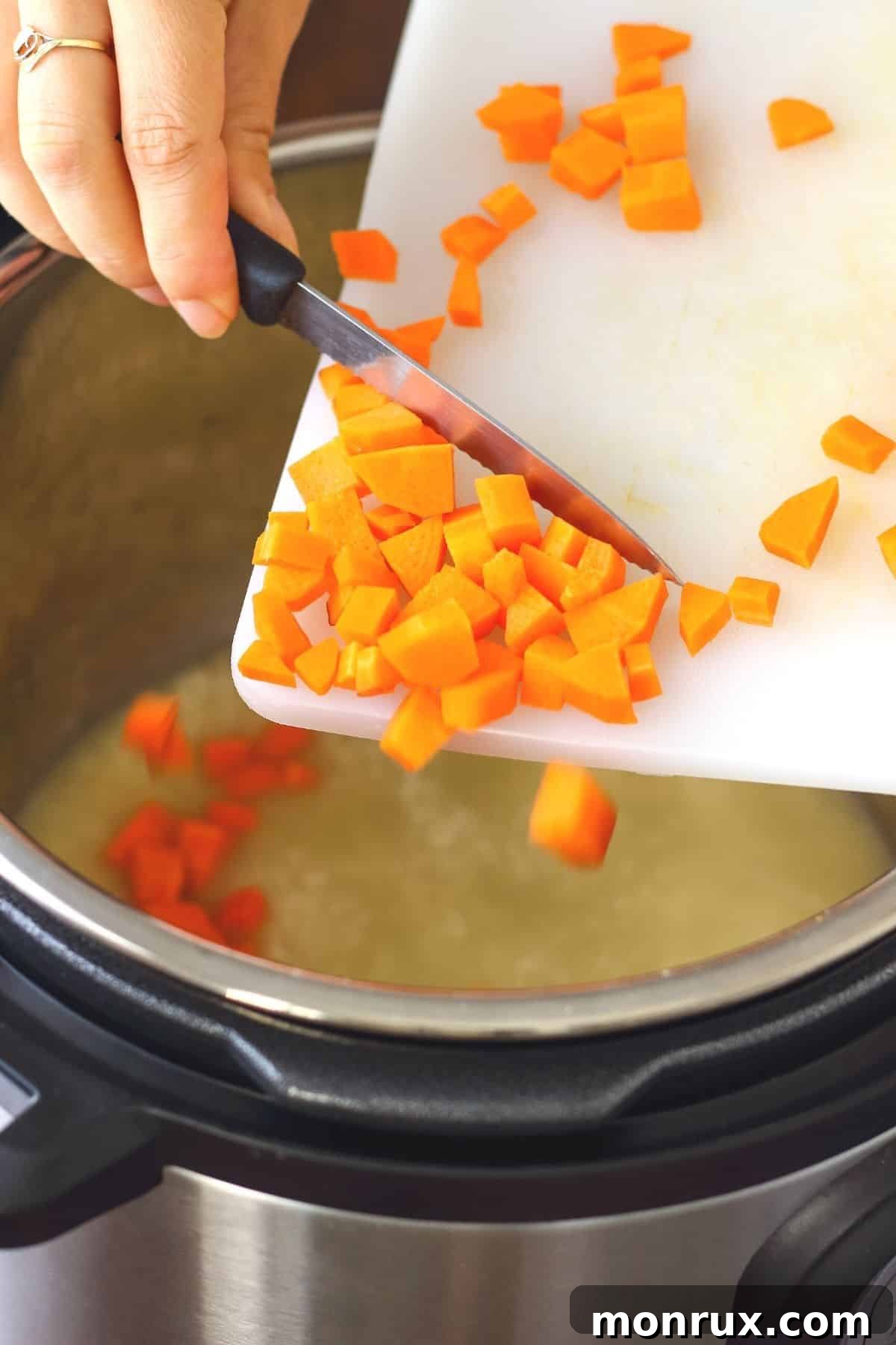 woman putting chopped carrots in an instant pot.