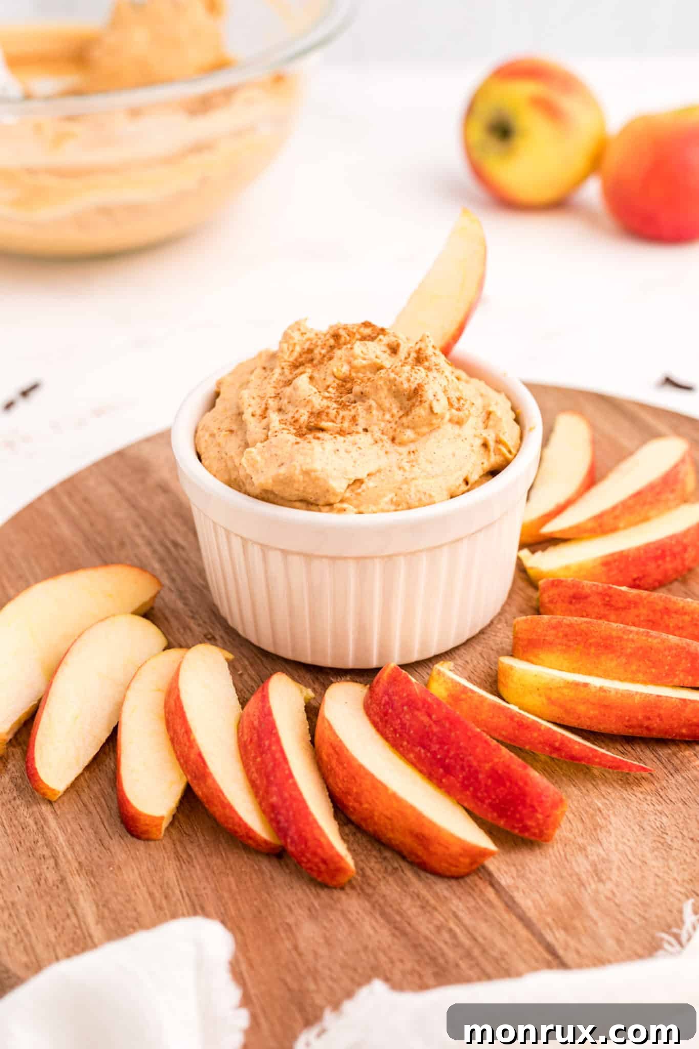 vegan pumpkin dip with sliced apples.