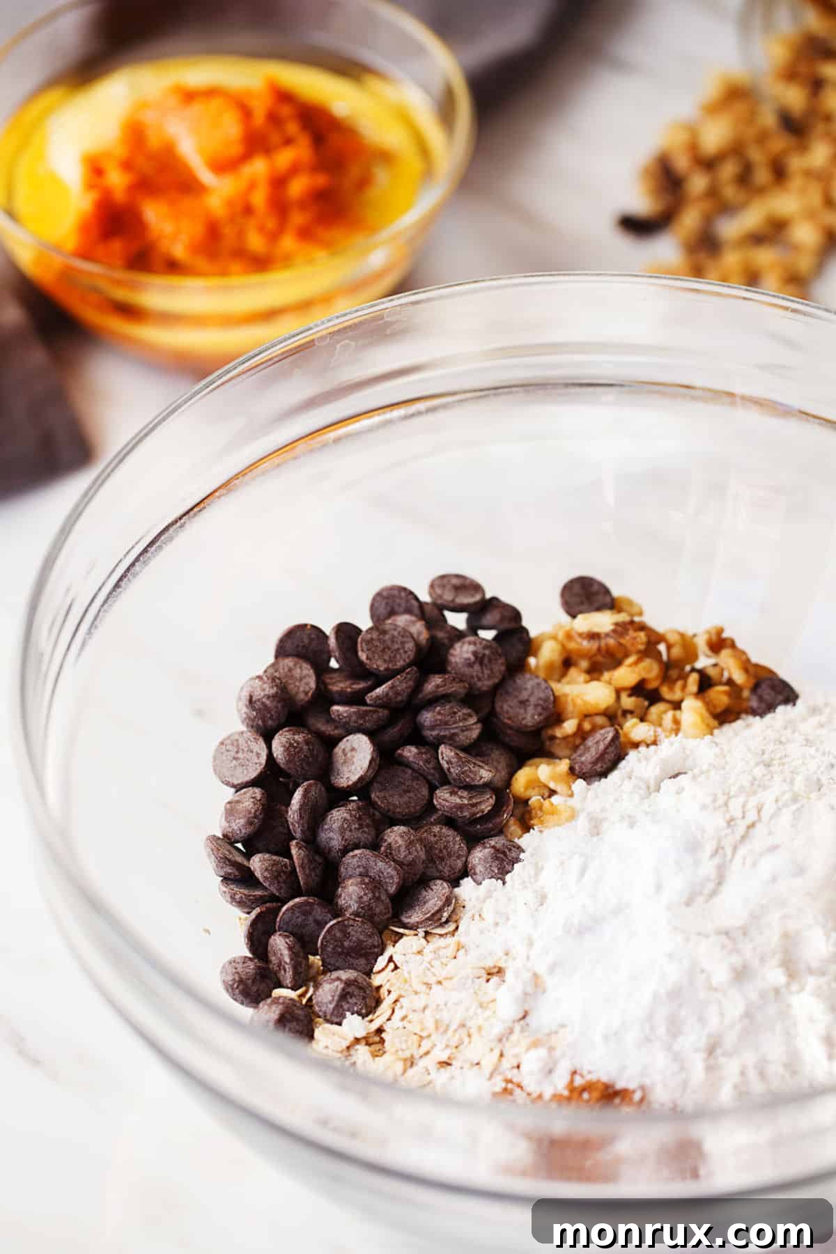ingredients for sweet potato muffins in mixing bowl.