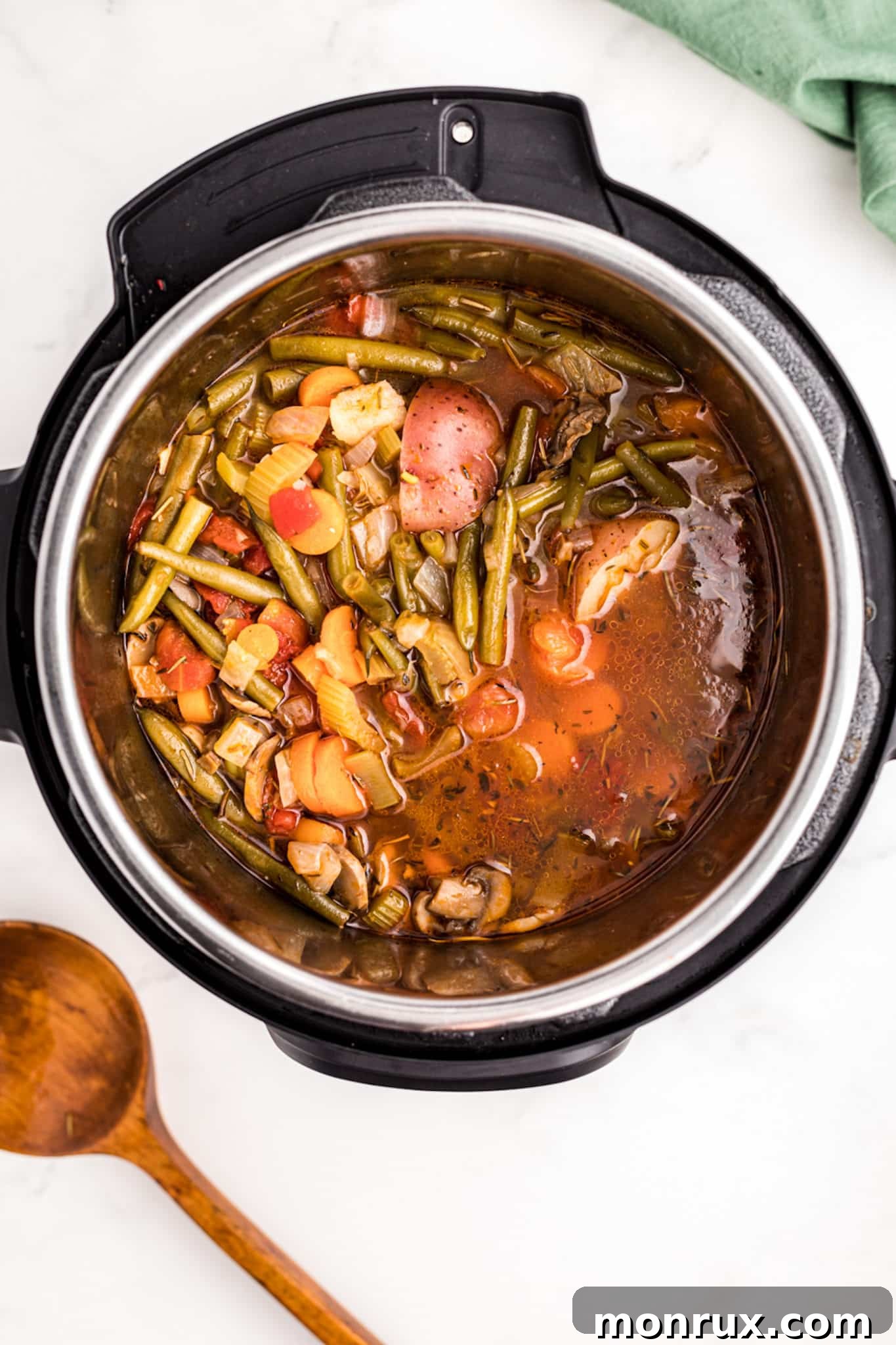 cooked veggie stew in pressure cooker.