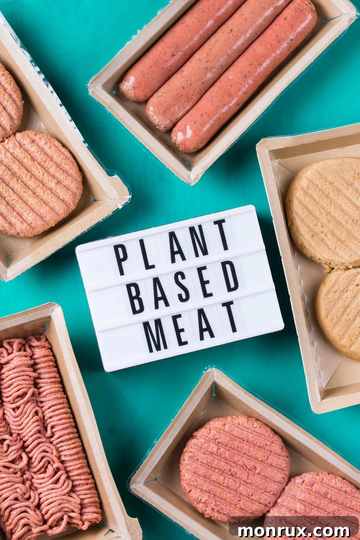 Assortment of plant-based meat products on a countertop, ready for cooking and consumption.