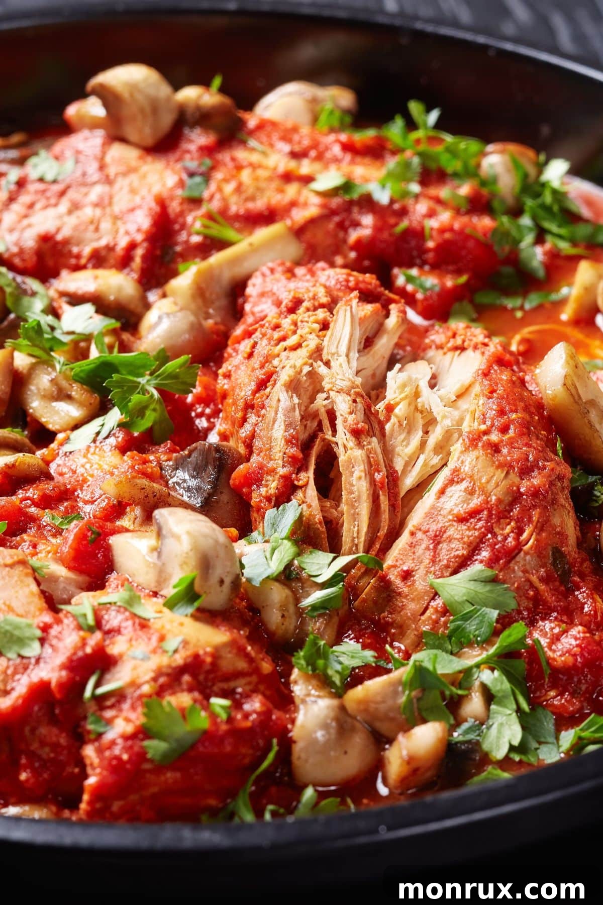 Keto Chicken Cacciatore with mushrooms in a pan, ready to be served, highlighting its rich sauce and vibrant vegetables.
